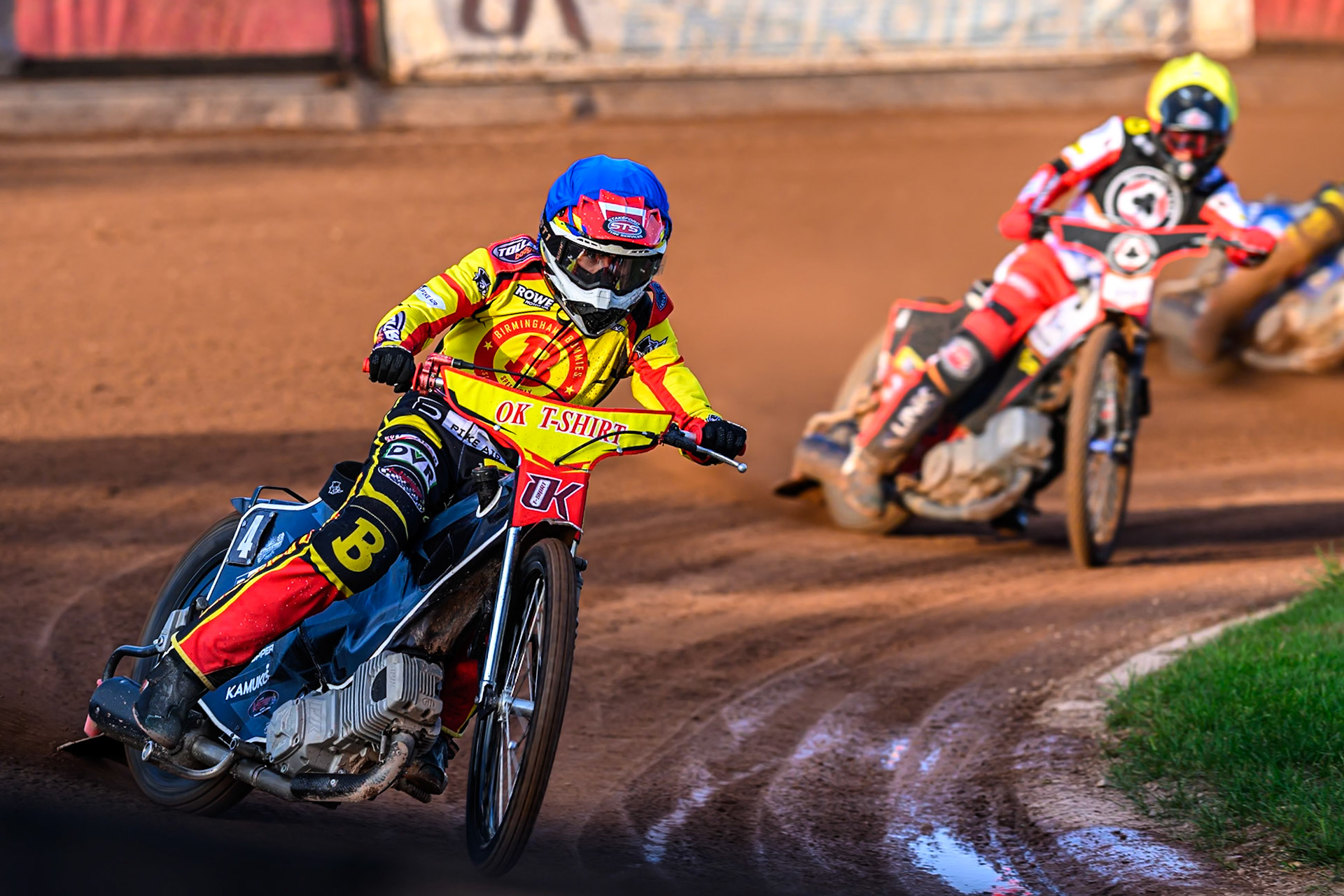 Birmingham Brummies' Keynan Rew  in Blue leading Belle Vue Aces' Zach Cook  in Yellow during the Rowe Motor Oil Premiership match between Birmingham Brummies and Belle Vue Aces at Perry Barr Stadium, Birmingham on Monday 28th July 2025. (Photo: Ian Charles | MI News)