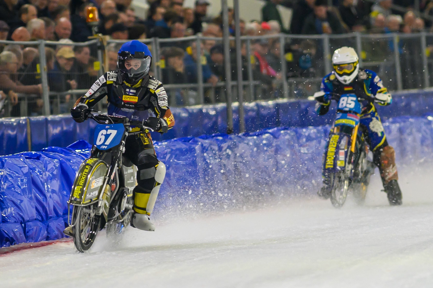 Heikki Huusko (67) of Finland  in Blue leading Luca Bauer (85) of Italy/Germany  in White during the FIM Ice Speedway Gladiators World Championship Final 3 at Ice Rink Thialf, Heerenveen on Saturday 11th April 2026. (Photo: Ian Charles | MI News)