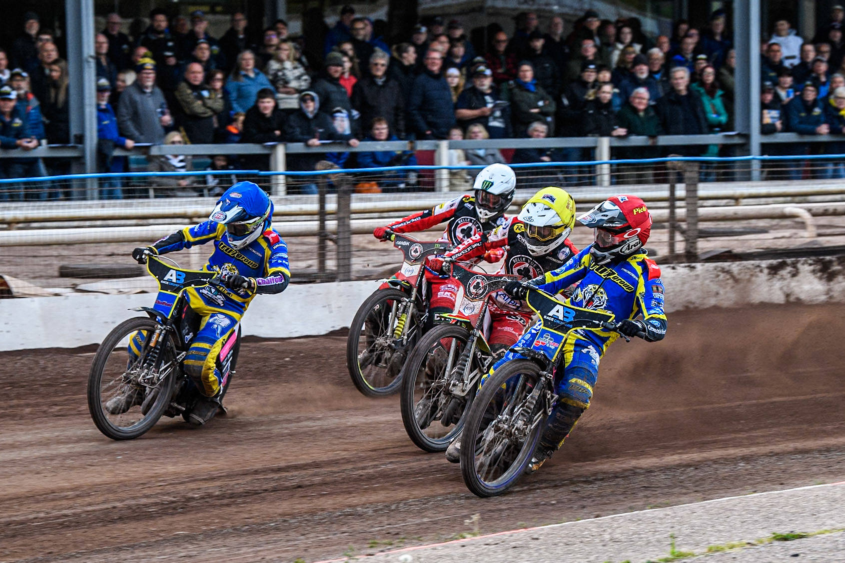 Josh Pickering of Sheffield Tigers in Red and Leon Flint of Sheffield Tigers in Blue leading Tate Zischke of Belle Vue Aces in Yellow and Jaimon Lidsey of Belle Vue Aces in White during the Rowe Motor Oil Premiership match between Sheffield Tigers and Belle Vue Aces at Owlerton Stadium, Sheffield on Monday 5th May 2025. (Photo: Ian Charles | MI News)