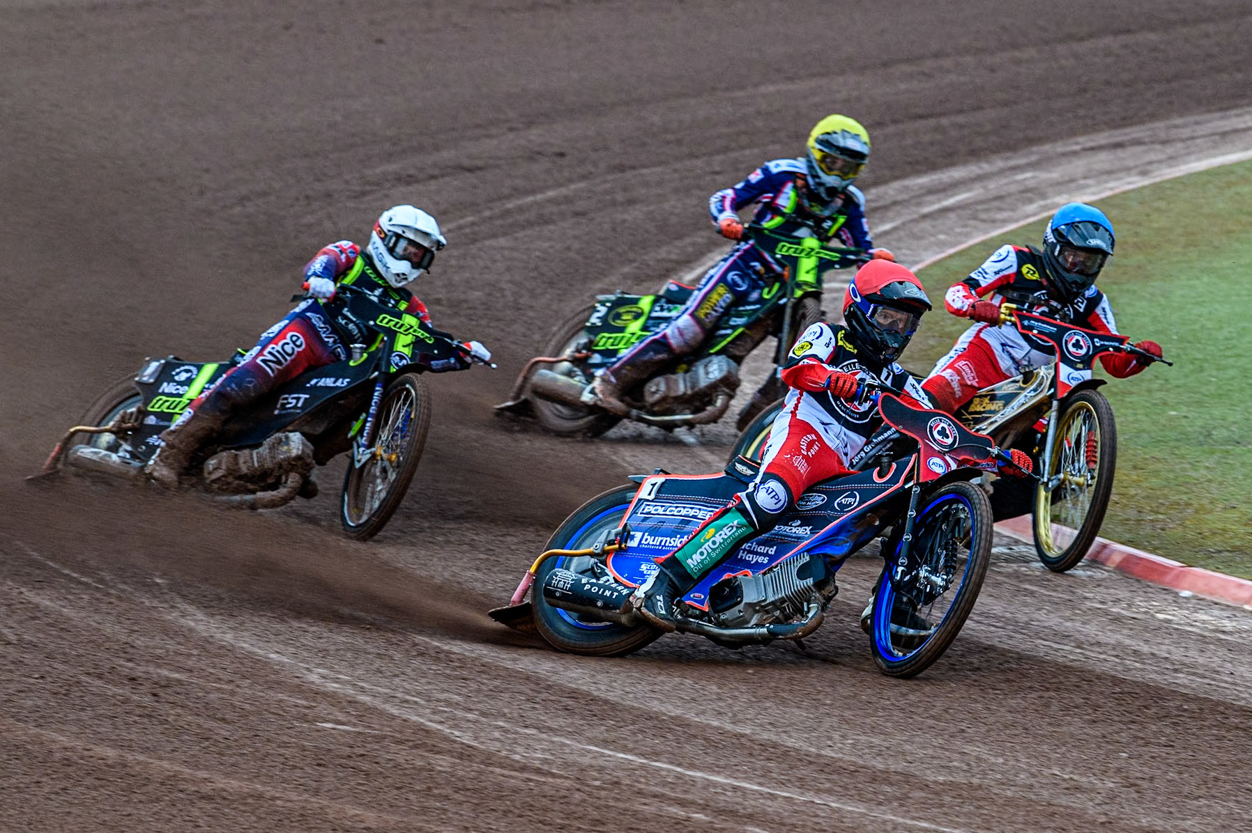 Belle Vue Aces' Brady Kurtz in Red and team mate Belle Vue Aces' Norick Blödorn in Blue leading Ipswich Witches' Emil Sayfutdinov in White and Ipswich Witches’Jordan Jenkins in Yellow during the Rowe Motor Oil Premiership match between Belle Vue Aces and Ipswich Witches at the National Speedway Stadium, Manchester on Monday 22nd April 2024. (Photo: Ian Charles | MI News)