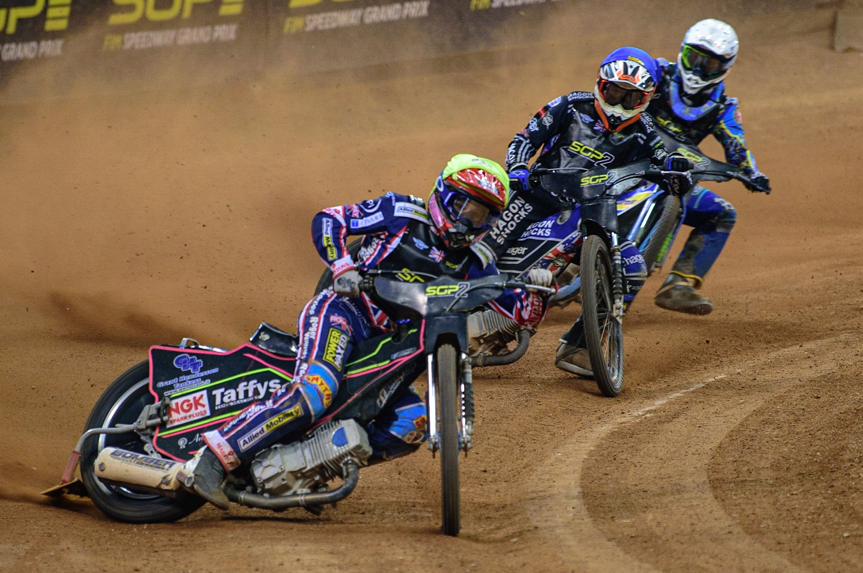 Leon Flint (Great Britain)  (Yellow) leads Jason Edwards (Great Britain) (Blue) and Petr Chlupac (Czech Republic)  (White) during the FIM  Speedway Grand Prix  2 of Great Britain at the Principality Stadium, Cardiff on Sunday 14th August 2022. (Credit: Ian Charles | MI News)
