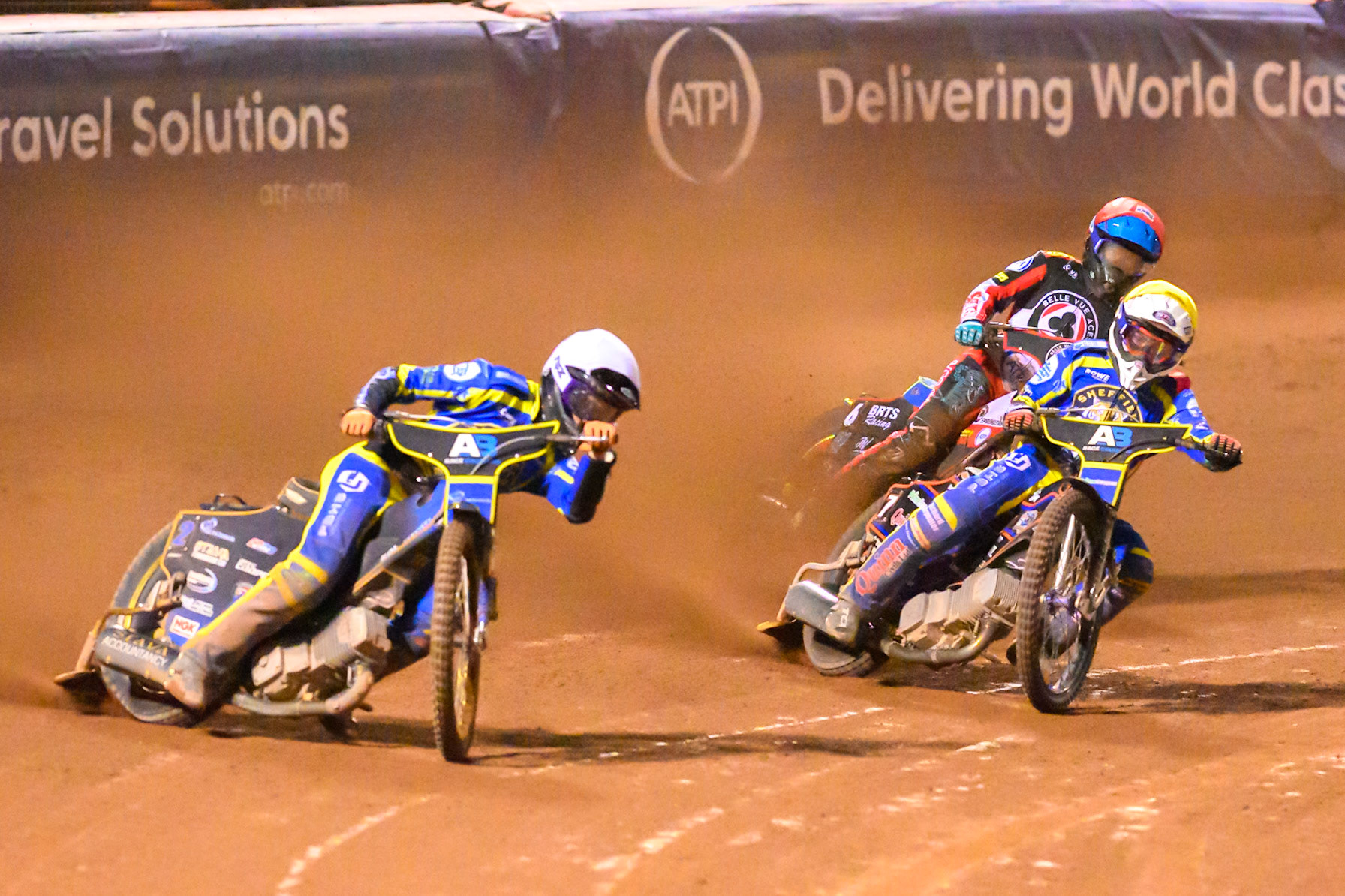 Anders Rowe of Sheffield Tigers    in White and Luke Killeen of Sheffield Tigers in Yellow leading Tate Zischke of Belle Vue Aces   in Red during the Knockout Cup, Northern Section match between Belle Vue Aces and Sheffield Tigers at the National Speedway Stadium, Manchester on Monday 30th March 2026. (Photo: Ian Charles | MI News)