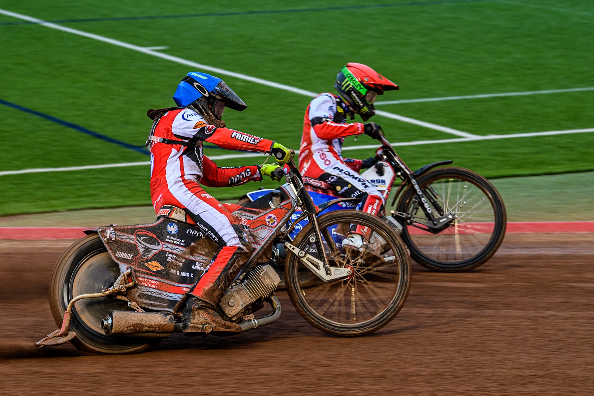 Belle Vue Aces' Connor Bailey in Blue rides outside team mate Belle Vue Aces' Dan Bewley in Red during the Rowe Motor Oil Premiership match between Belle Vue Aces and Oxford Spires at the National Speedway Stadium, Manchester on Monday 13th May 2024. (Photo: Ian Charles | MI News)