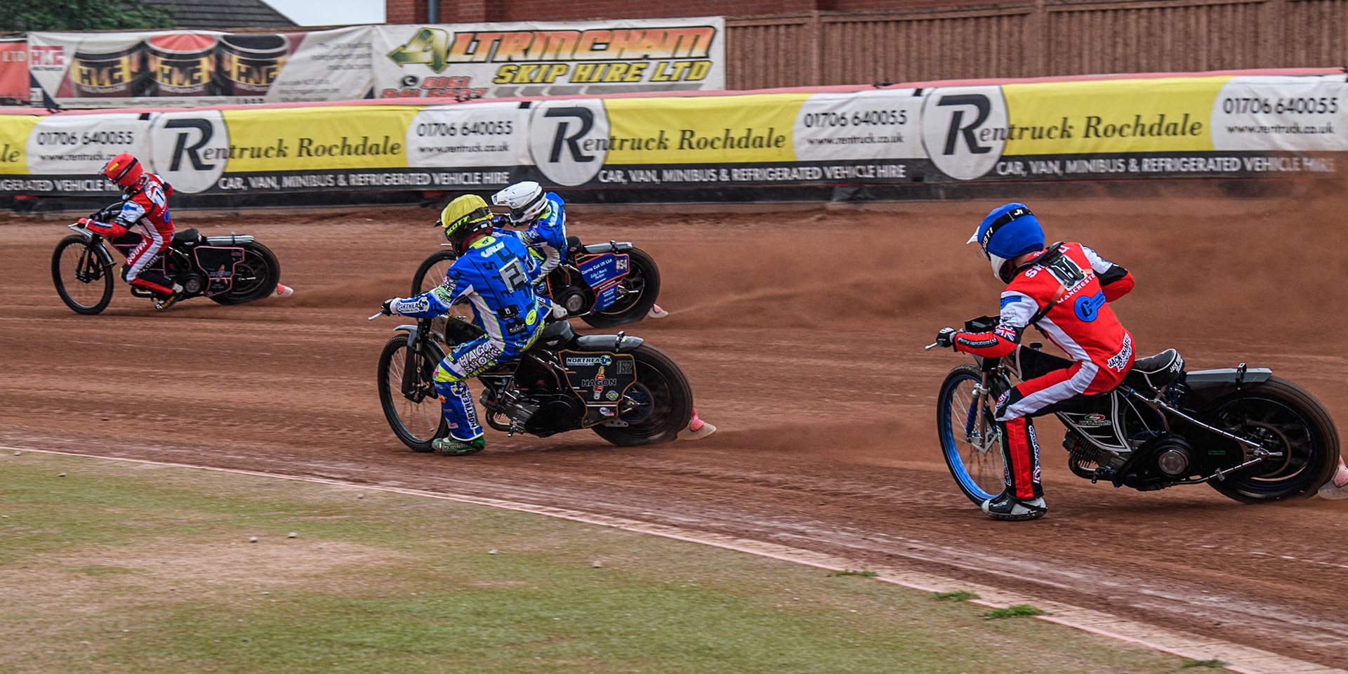 Belle Vue Colts' Jack Shimelt  in Blue chases Oxford Chargers' Ashton Vale  in Yellow, Oxford Chargers' Luke Killeen  in White and Belle Vue Colts' Sam Hagon  in Red during the WSRA National Development League match between Belle Vue Colts and Oxford Chargers at the National Speedway Stadium, Manchester on Friday 2nd August 2024. (Photo: Ian Charles | MI News)