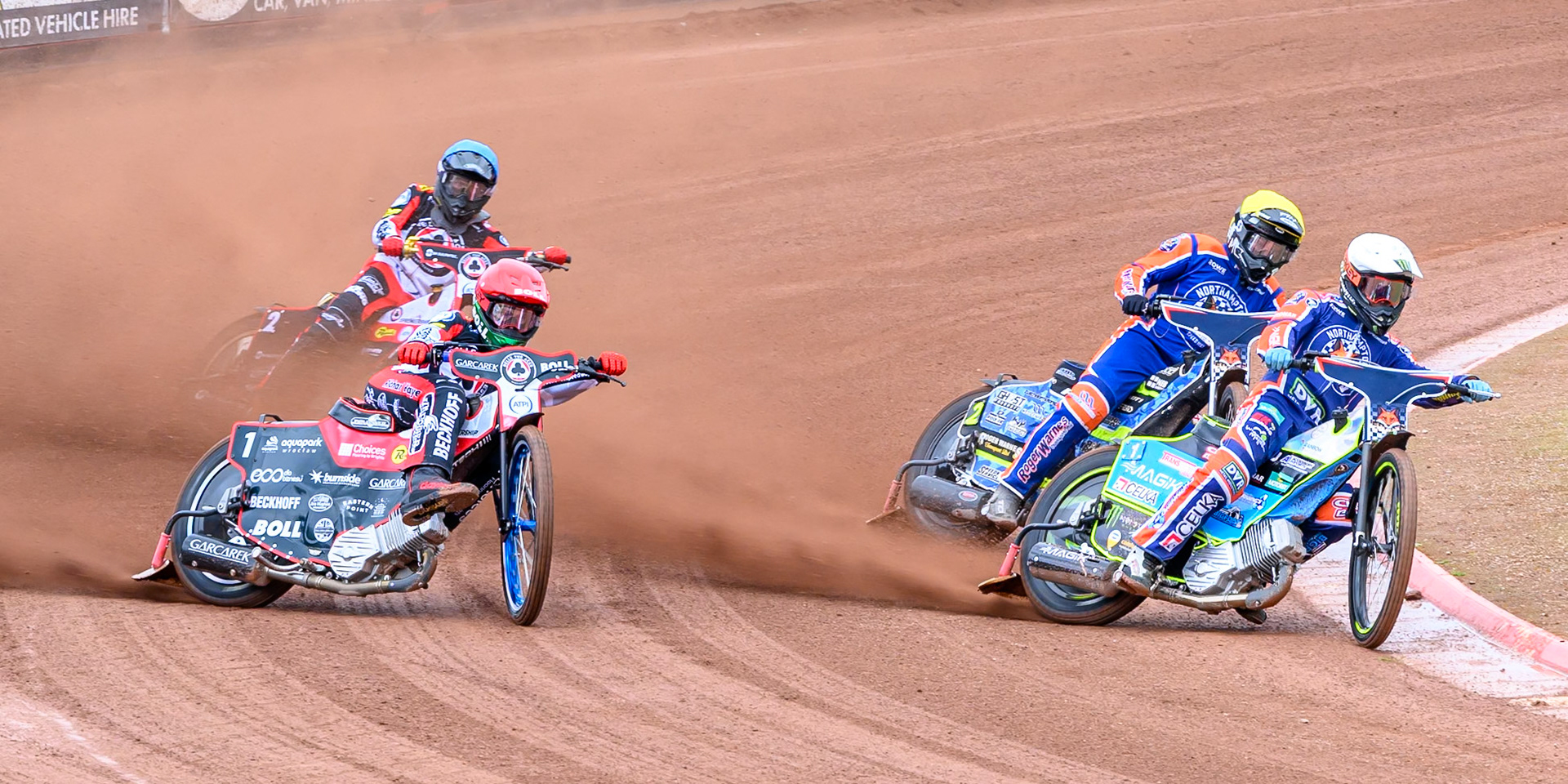 Jaimon Lidsey of Northampton Foxes in White leading Troy Batchelor of Northampton Foxes in Yellow, Brady Kurtz of Belle Vue Aces in Red and Norick Blödorn of Belle Vue Aces  in Blue during the Rowe Motor Oil Premiership match between Belle Vue Aces and Northampton Foxes at the National Speedway Stadium, Manchester on Monday 4th May 2026. (Photo: Ian Charles | MI News)