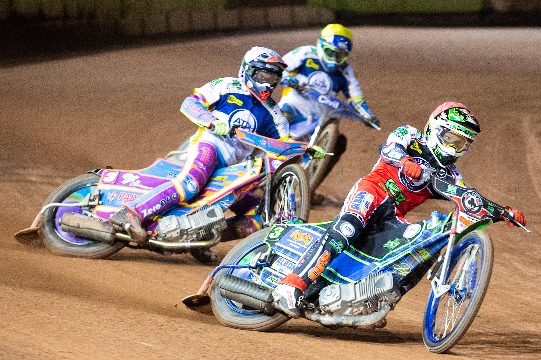 Photo: Ian CharlesDan Bewley of Belle Vue 'BikeRight' Aces  (Red) leads Rory Schlein of the 'ATPI' All Stars (White) and Richie Worrall of the 'ATPI' All Stars (Yellow)Belle Vue ‘Bikerite ’Aces v ‘ATPI’ All Stars, Premiership Challenge, National Speedway Stadium, Manchester Thursday  24  September  2020