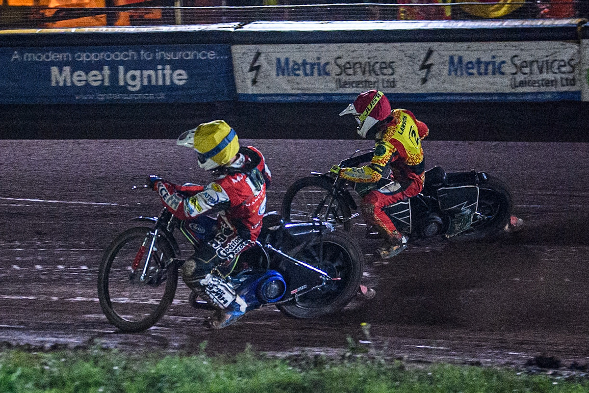 Belle Vue Aces' Jake Mulford in Yellow rides inside Leicester Lions' Richard Lawson in Red during the Rowe Motor Oil Premiership Grand Final 2nd Leg between Leicester Lions and Belle Vue Aces at the Pidcock Motorcycles Arena, Leicester on Thursday 26th September 2024. (Photo: Ian Charles | MI News)