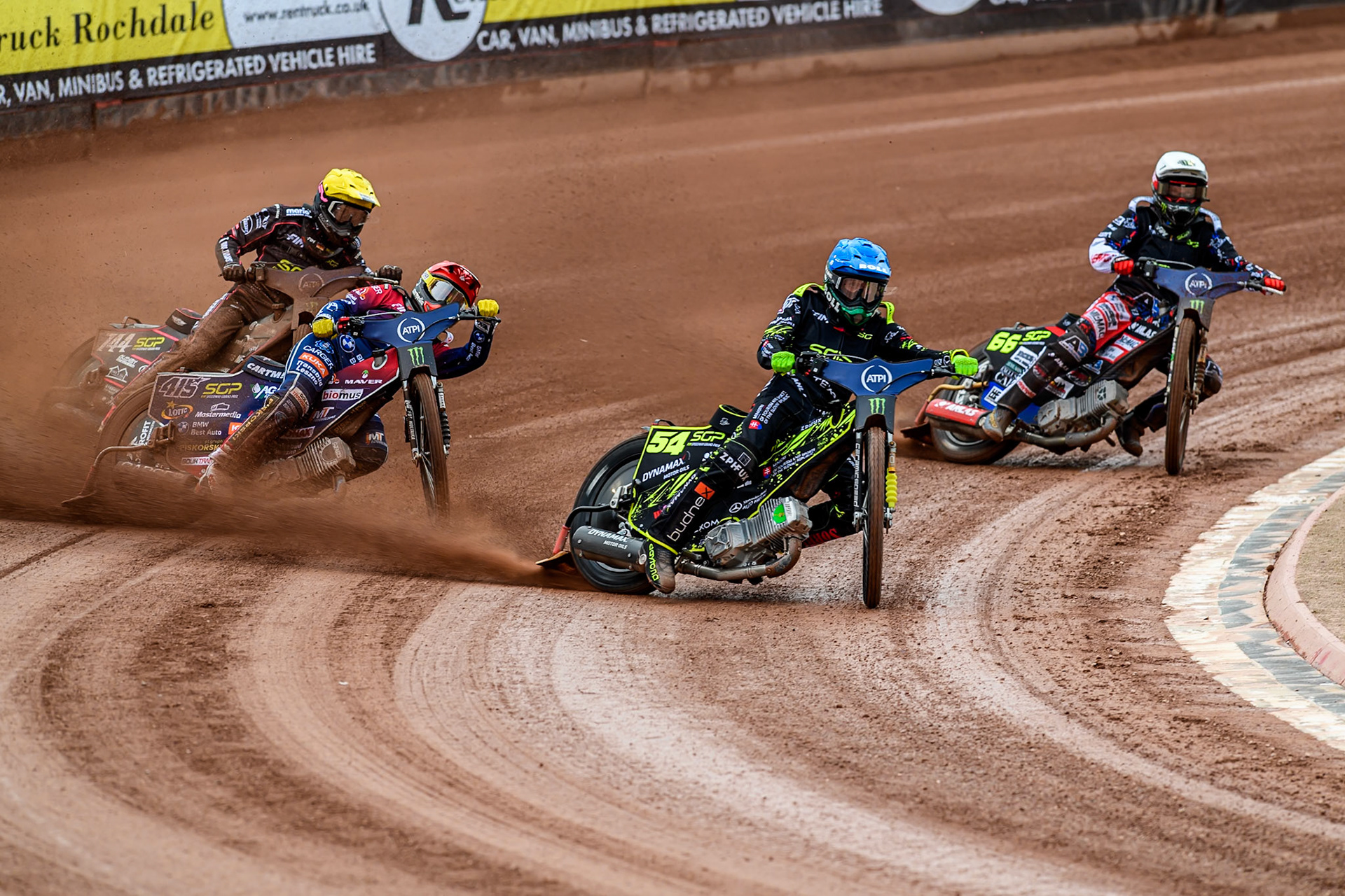 Martin Vaculik (54) of Slovakia in Blue leading Fredrik Lindgren (66) of Sweden in White, Dominik Kubera (415) of Poland in Red and Kai Huckenbeck (744) of Germany in Yellow during the ATPI FIM Speedway Grand Prix Round 4 at the National Speedway Stadium, Manchester, on Friday 13th June 2025. (Photo: Ian Charles | MI News)