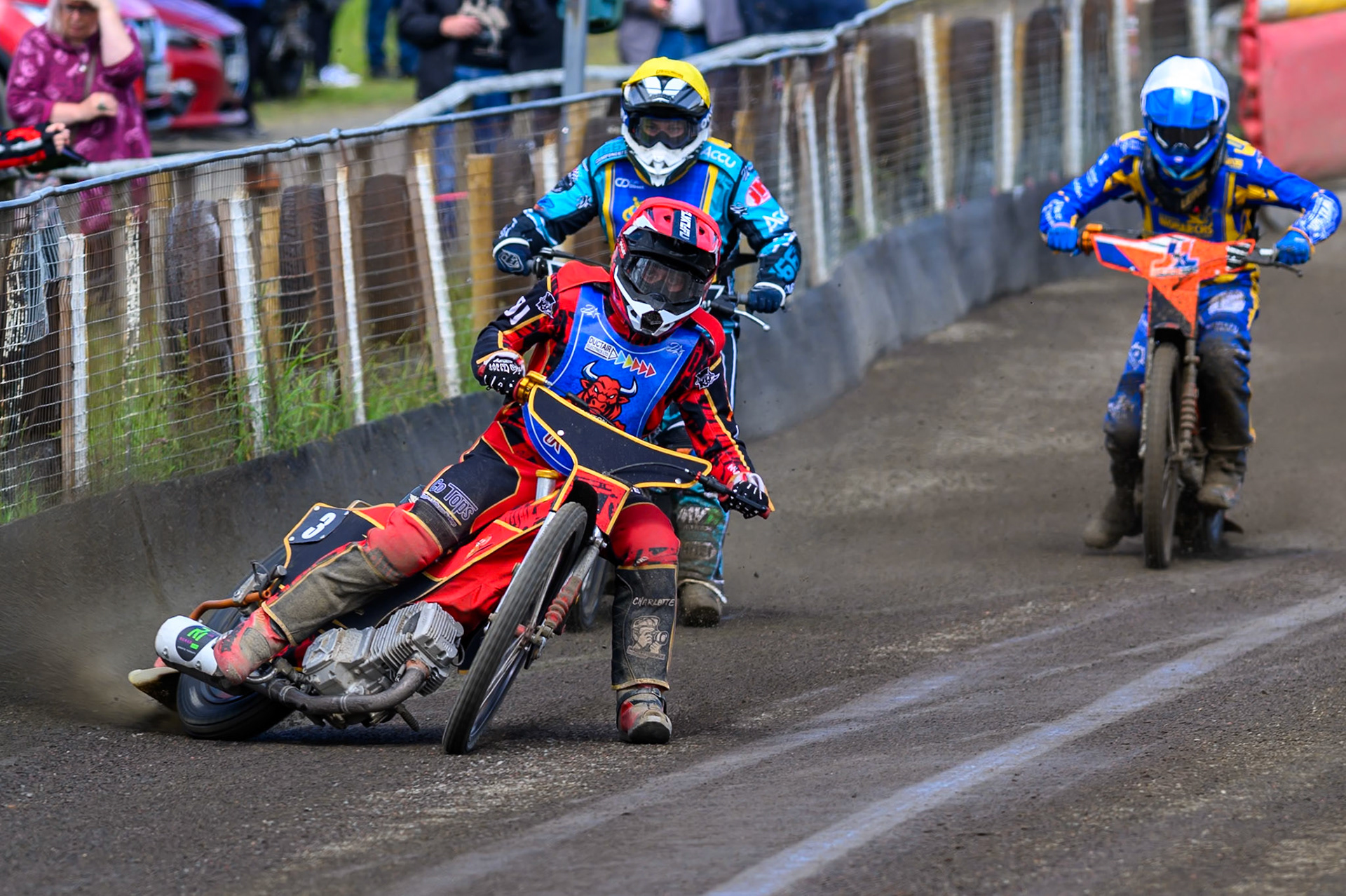Luke Harris of Buxton Bulls  in Red leading Jamie Halder of Edinburgh Monarchs Academy in Yellow and Jordy Loftus of Edinburgh Monarchs Academy in White during the WSRA National Development League match between Buxton Bulls and Edinburgh Monarchs Academy at Hi-Edge Speedway, Buxton on Sunday 14th June 2026. (Photo: Ian Charles | MI News)