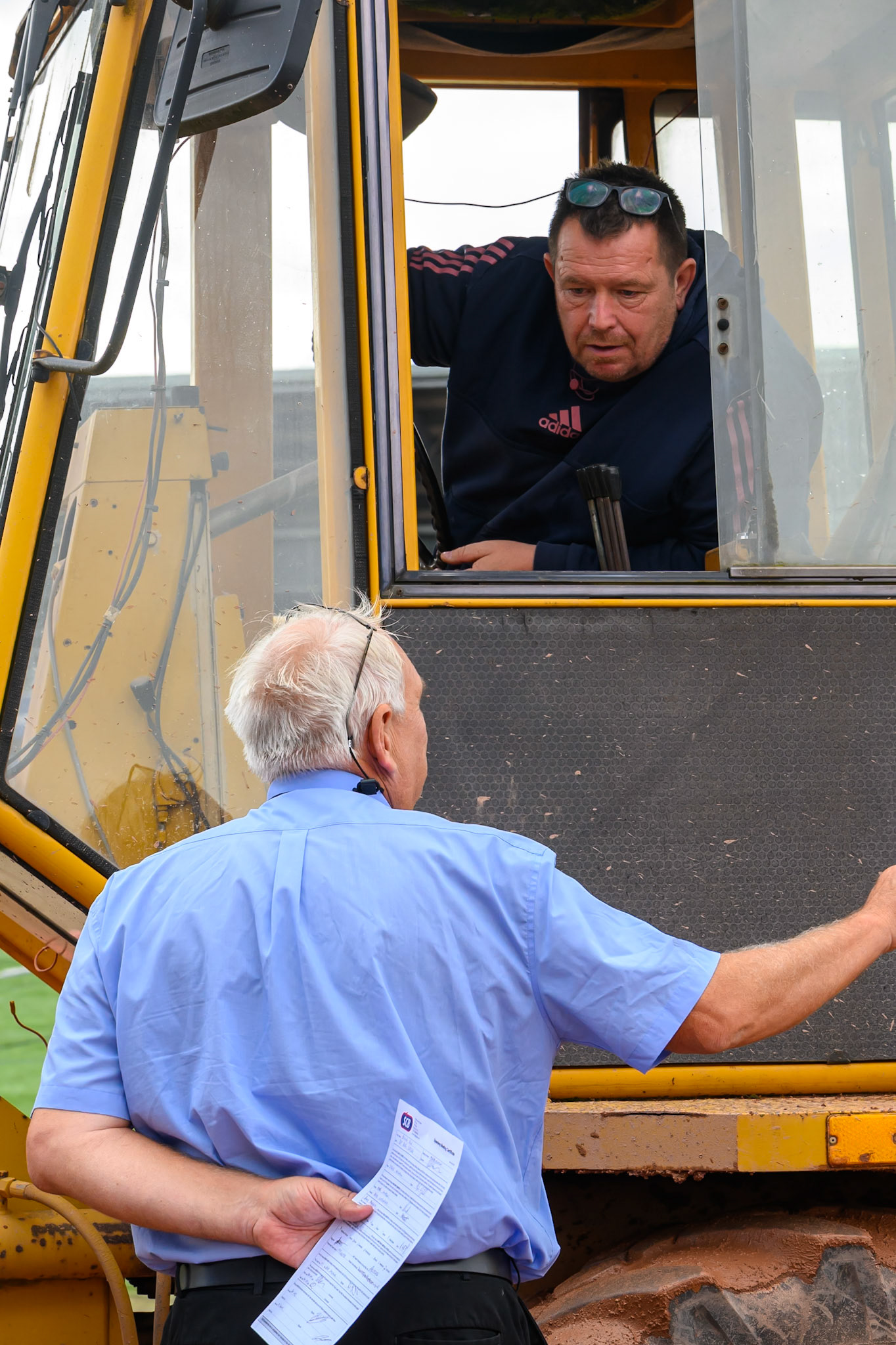 Referee Chris Durno discusses the track work with Track Curator Andy Meredith before the rain off during the Rowe Motor Oil Premiership match between Belle Vue Aces and Sheffield Tigers at the National Speedway Stadium, Manchester on Monday 31st August 2026. (Photo: Ian Charles | MI News)