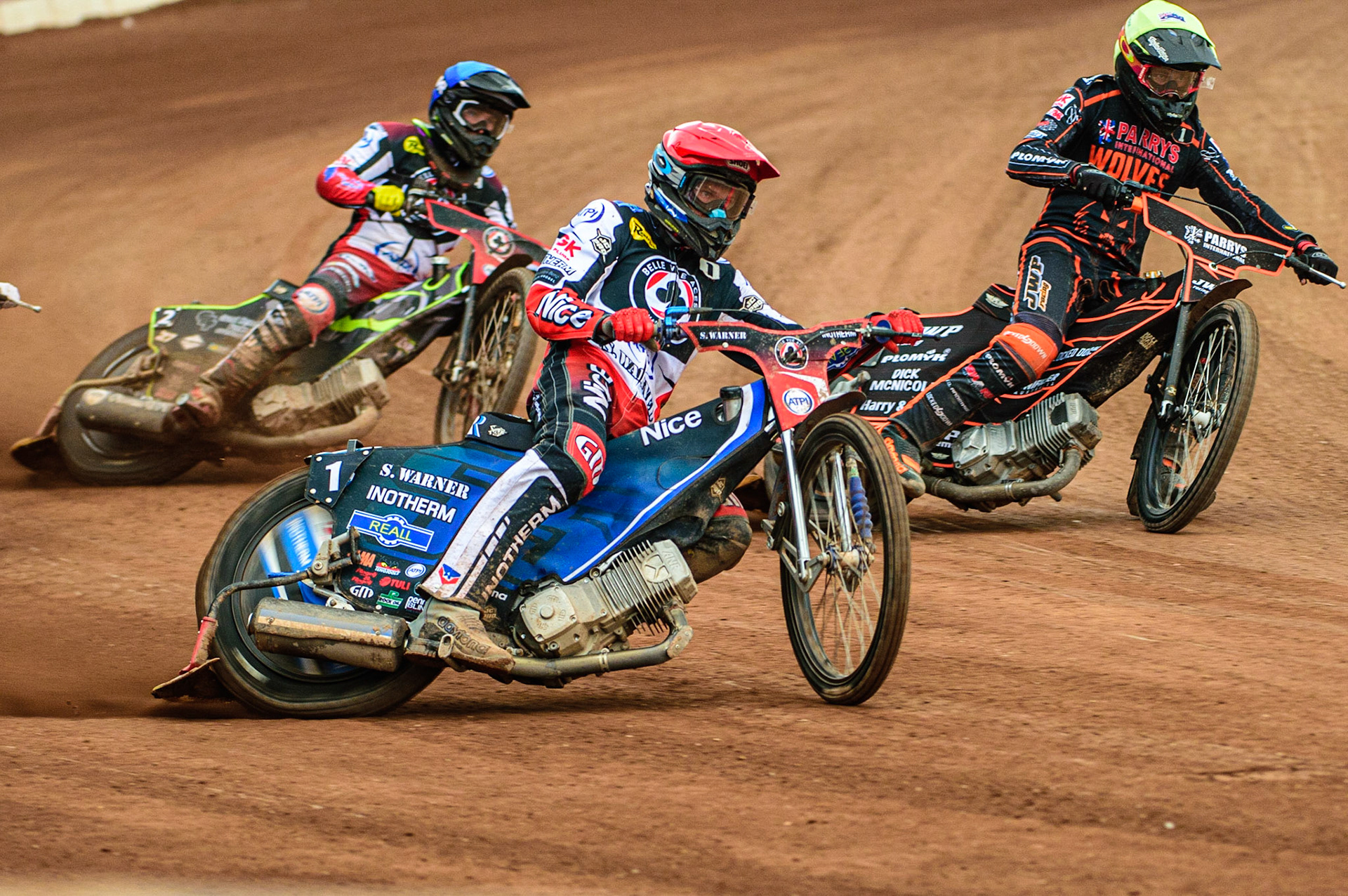 Matej Zagar  (Red) outside Tom Brennan  (Blue) and Sam Masters (Yellow) during the SGB Premiership match between Belle Vue Aces and Wolverhampton Wolves at the National Speedway Stadium, Manchester on Monday 29th August 2022. (Credit: Ian Charles | MI News)