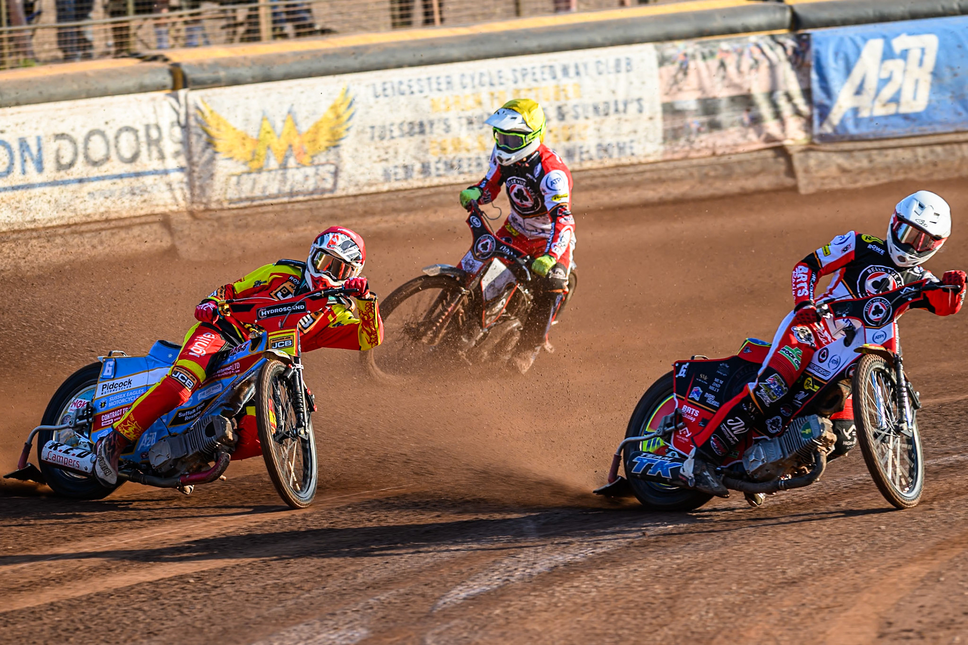 Belle Vue Aces' Tate Zischke in White rides inside Leicester Lions' Drew Kemp in Red with Belle Vue Aces' Jake Mulford in Yellow behind during the Rowe Motor Oil Premiership match between Leicester Lions and Belle Vue Aces at the Hydroscand Arena, Leicester on Thursday 19th June 2025. (Photo: Ian Charles | MI News)