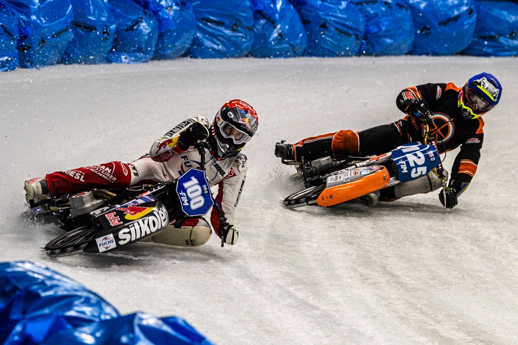 Franky Zorn (100) of Austria in Red leading Sebastian Reitsma (125) of The Netherlands in Blue during the Ice Speedway Gladiators World Championship Final 1 at Max-Aicher-Arena, Inzell on Saturday 15th March 2025. (Photo: Ian Charles | MI News)