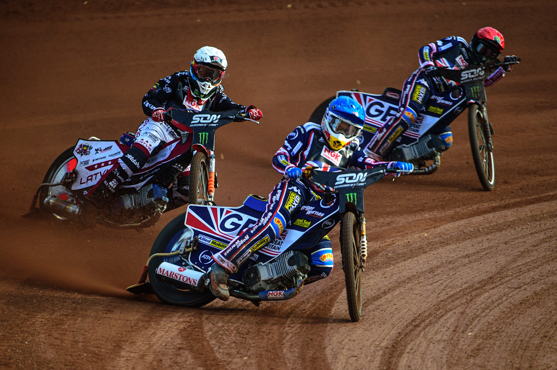 MANCHESTER, UK. OCT 16TH Robert Lambert of Great Britain (Blue) leads Andzejs Lebedevs of Latvia (White) and Robert Lambert of Great Britain (Red) during the Monster Energy FIM Speedway of Nations at the National Speedway Stadium, Manchester on Saturday  16th October 2021. (Credit: Ian Charles | MI News)
