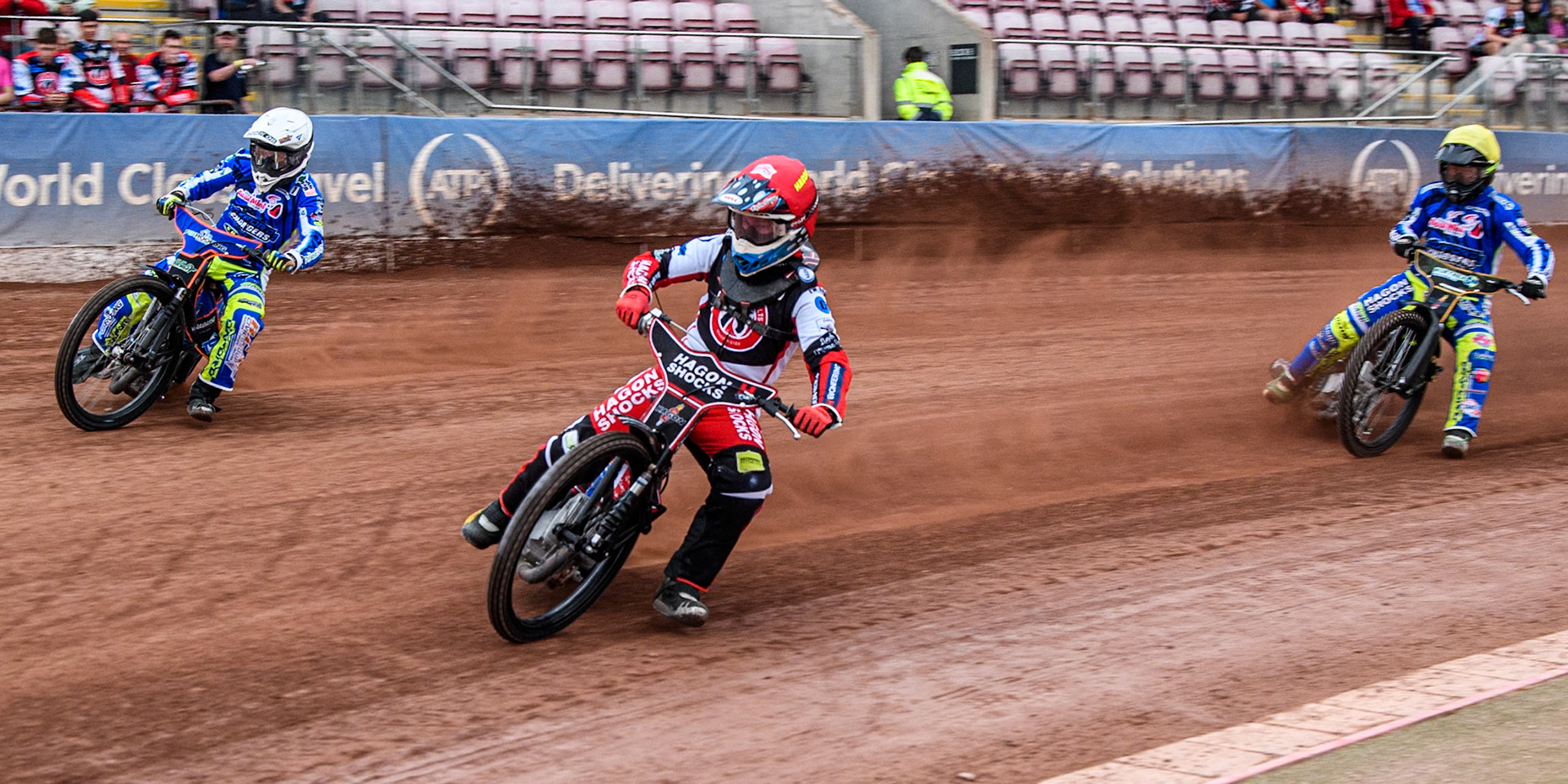 Belle Vue Colts' Sam Hagon  in Red rides inside Oxford Chargers' Luke Killeen  in White with Oxford Chargers' Ashton Vale  behind during the WSRA National Development League match between Belle Vue Colts and Oxford Chargers at the National Speedway Stadium, Manchester on Friday 2nd August 2024. (Photo: Ian Charles | MI News)