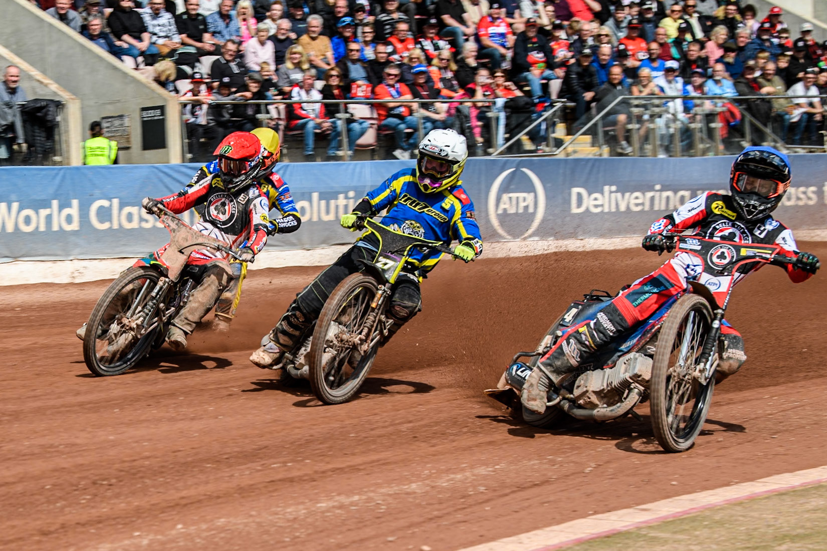 Belle Vue Aces' Ben Cook  in Blue rides inside Sheffield Tigers' Guest Rider Tom Brennan  in White and Belle Vue Aces' Jaimon Lidsey  in Red with Sheffield Tigers' Jason Edwards  in Yellow behind during the Rowe Motor Oil Premiership match between Belle Vue Aces and Sheffield Tigers at the National Speedway Stadium, Manchester on Monday 26th August 2024. (Photo: Ian Charles | MI News)