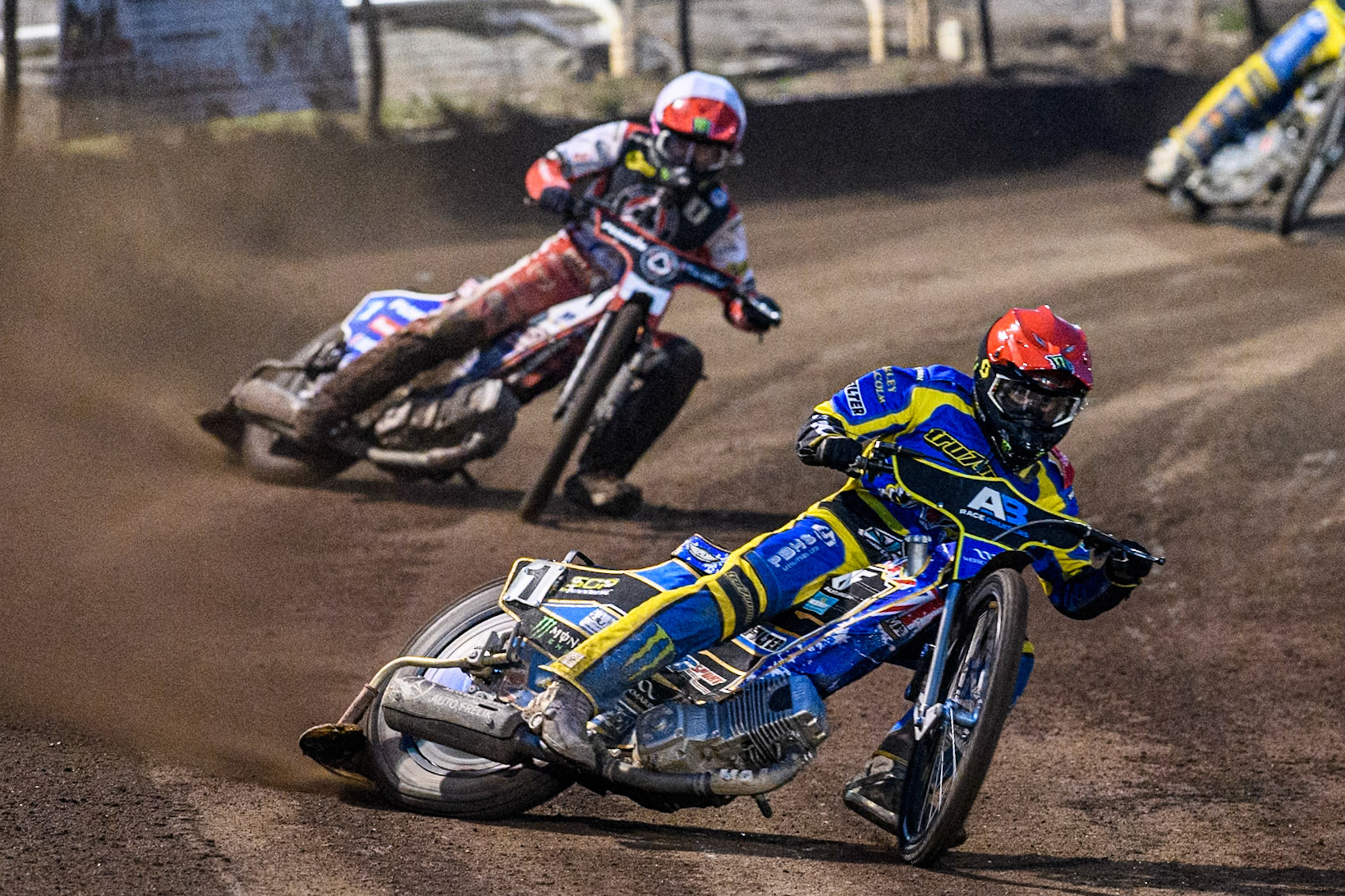 Sheffield Tigers' Jack Holder  in Red leading Belle Vue Aces' Dan Bewley   in White during the Rowe Motor Oil Premiership match between Sheffield Tigers and Belle Vue Aces at Owlerton Stadium, Sheffield on Monday 26th August 2024. (Photo: Ian Charles | MI News)
