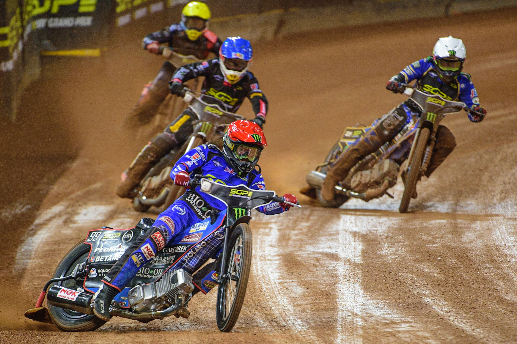 Dan Bewley (99) (Red) leads Maciej Janowski (71) (Blue) Jack Holder (25) (White) and Andžejs Ļebedevs (29) (Yellow) during the FIM  Speedway Grand Prix of Great Britain at the Principality Stadium, Cardiff on Saturday 13th August 2022. (Credit: Ian Charles | MI News