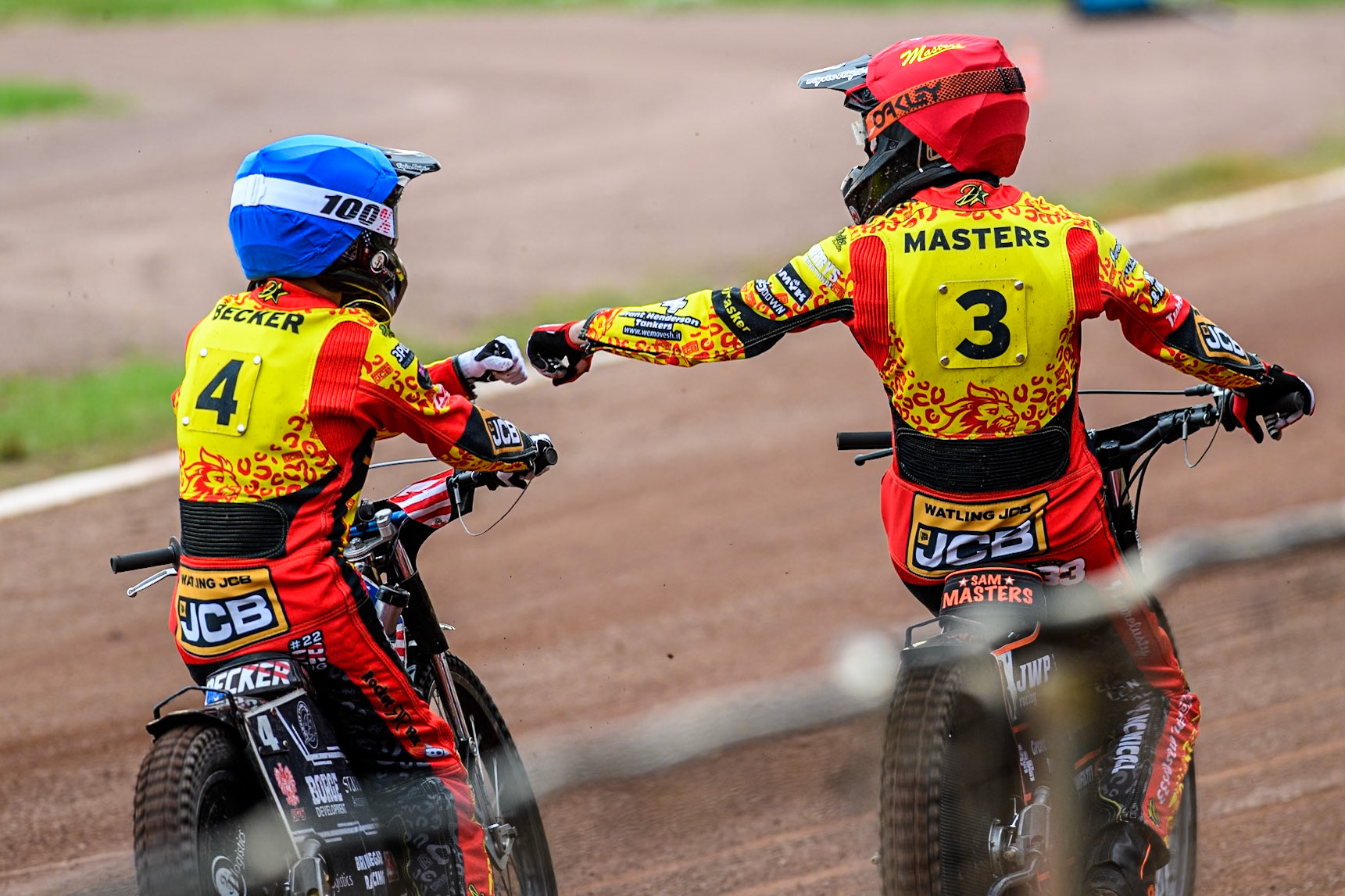 Leicester Lions' Luke Becker in Blue and team mate Sam Masters celebrate their 5-1 heat win during the Rowe Motor Oil Premiership match between Leicester Lions and Belle Vue Aces at the Pidcock Motorcycles Arena, Leicester on Thursday 25th July 2024. (Photo: Ian Charles | MI News)