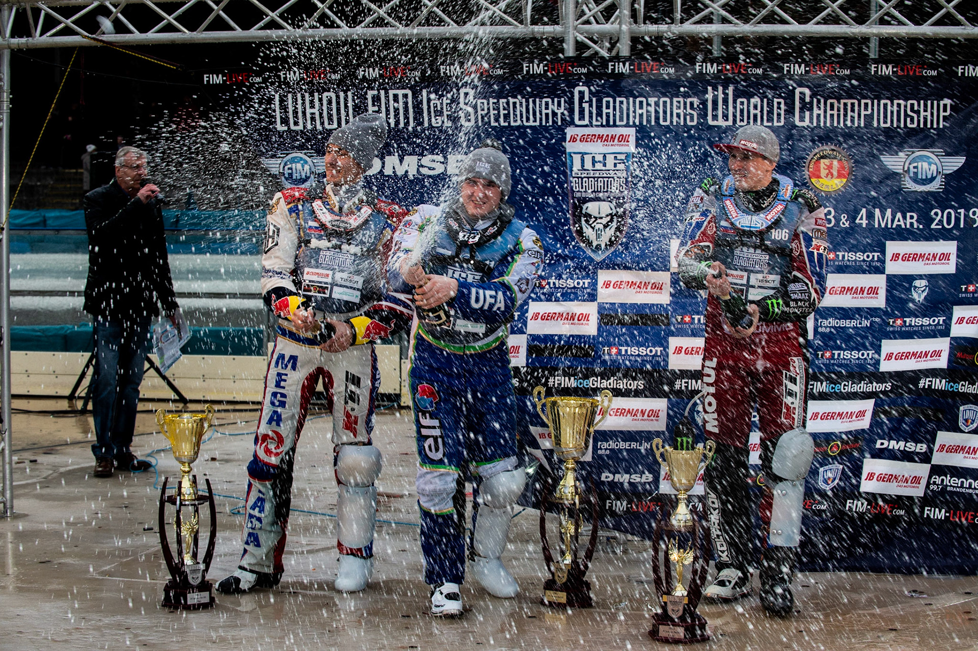 Photo: Ian Charles

Top 3 Sunday: (l-r) Danil Ivanov (333)(2nd), 114\ (Winner) Dmitri Koltakov (106) (3rd) spraying the champagne 

FIM Ice Speedway Gladiators World Championship, Final 3.2, Horst-Dohm Eisstadion, Berlin, Germany Sunday  3  March  2019