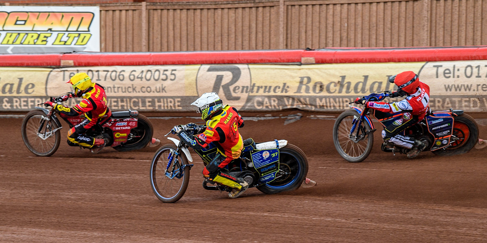 Chris Harris (White) inside team mate Max Fricke (Yellow) with Brady Kurtz (Red) behind during the Sports Insure Premiership match between Belle Vue Aces and Leicester Lions at the National Speedway Stadium, Manchester on Monday 28th August 2023. (Photo: Ian Charles | MI News)