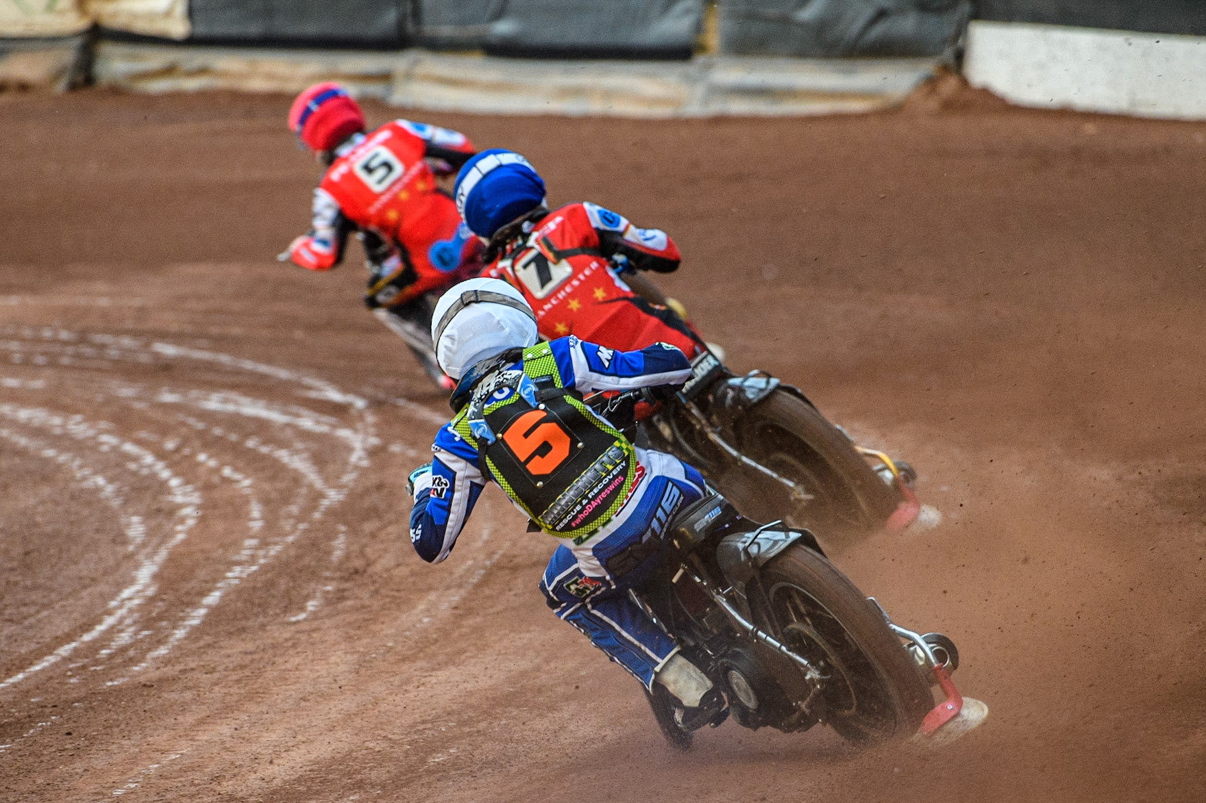 Sam McGurk (White) chases Freddy Hodder (Blue) and James Pearson (Red) during the National Development League match between Belle Vue Colts and Mildenhall Fens Tigers at the National Speedway Stadium, Manchester on Friday 26th May 2023. (Photo: Ian Charles | MI News)