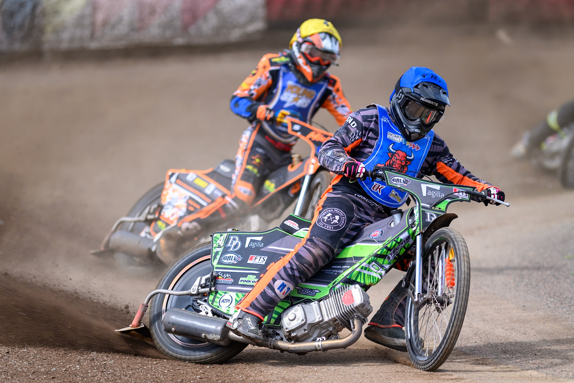 Jack Roberts of Buxton Bulls in Blue leading Mickie Simpson of Kings Lynn Young Stars in Yellow during the WSRA National Development League match between Buxton Bulls and King's Lynn Young Stars at Hi-Edge Speedway, Buxton on Sunday 9th August 2026. (Photo: Ian Charles | MI News)