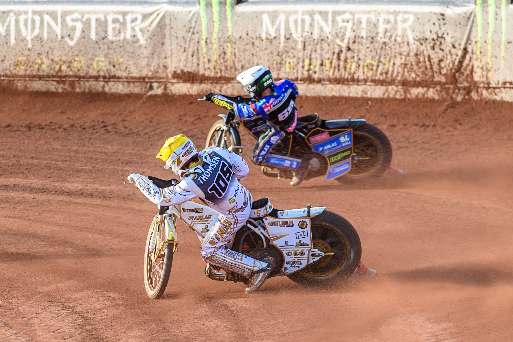 Anders Thomsen (105) of Denmark in Yellow on the inside  of Jason Doyle (69) of Australia in White during the ATPI FIM Speedway Grand Prix Round 5 at the National Speedway Stadium, Manchester, on Saturday 14th June 2025. (Photo: Ian Charles | MI News)