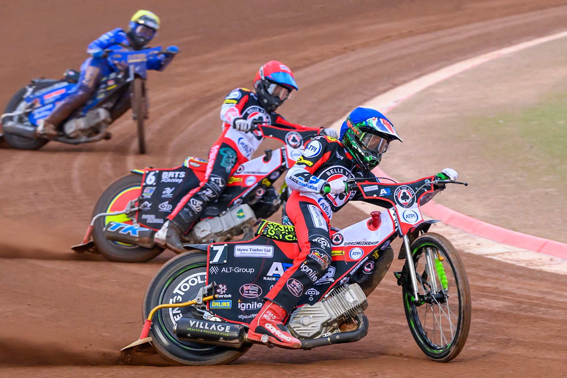 William Cairns of Belle Vue Aces in Blue leading Tate Zischke of Belle Vue Aces in Red  and Jody Scott of Kings Lynn Stars in Yellow  during the Rowe Motor Oil Premiership match between Belle Vue Aces and King's Lynn Stars at the National Speedway Stadium, Manchester on Monday 29th June 2026. (Photo: Ian Charles | MI News)