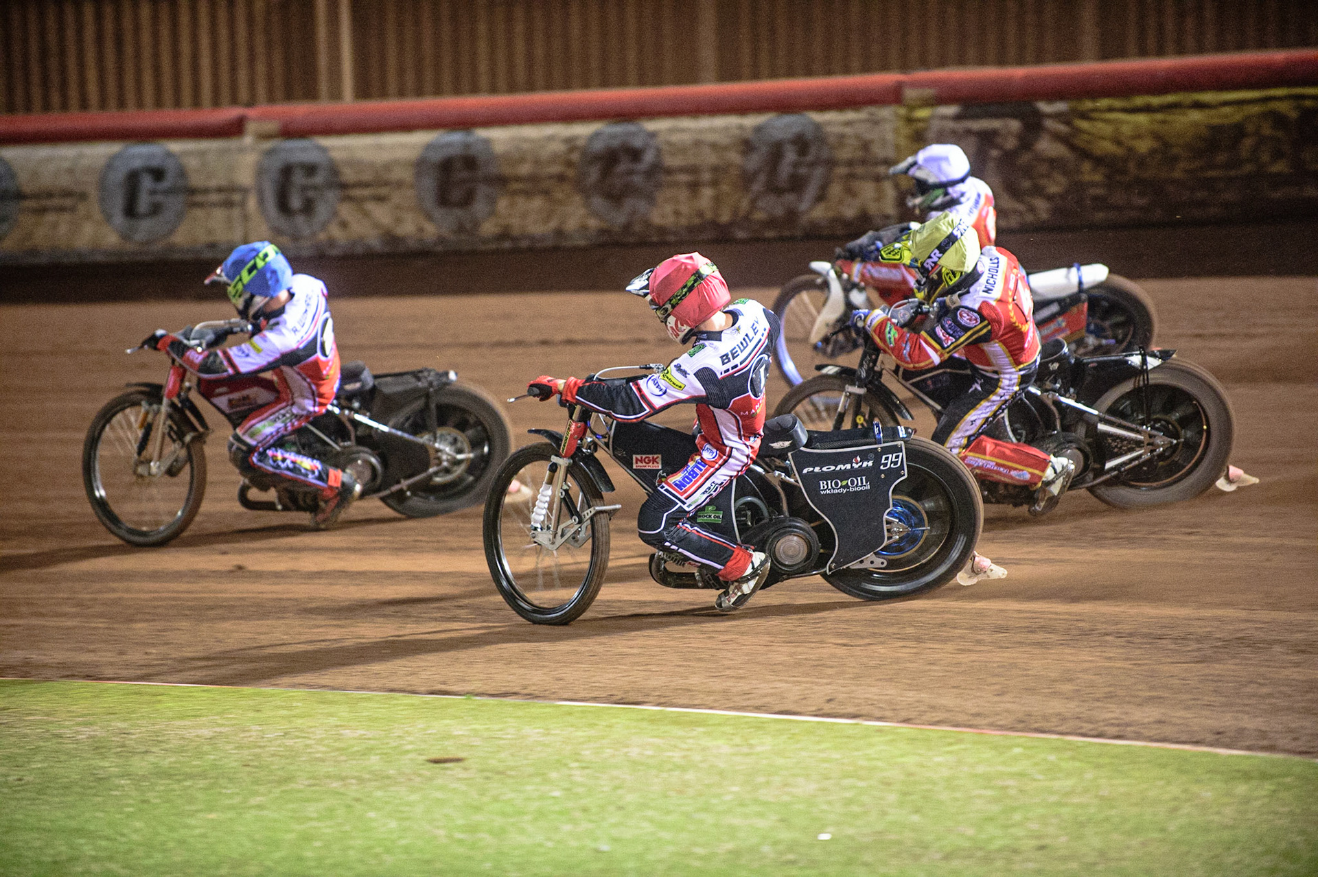 MANCHESTER, UK. OCT 11TH  Richie Worrall  (Blue) leads as Dan Bewley  (Red) goes inside Scott Nicholls  (Yellow) and Hans Andersen  (White) during the SGB Premiership Grand Final 1st Leg between Belle Vue Aces and Peterborough Panthers at the National Speedway Stadium, Manchester on Monday 11th October 2021. (Credit: Ian Charles | MI News)