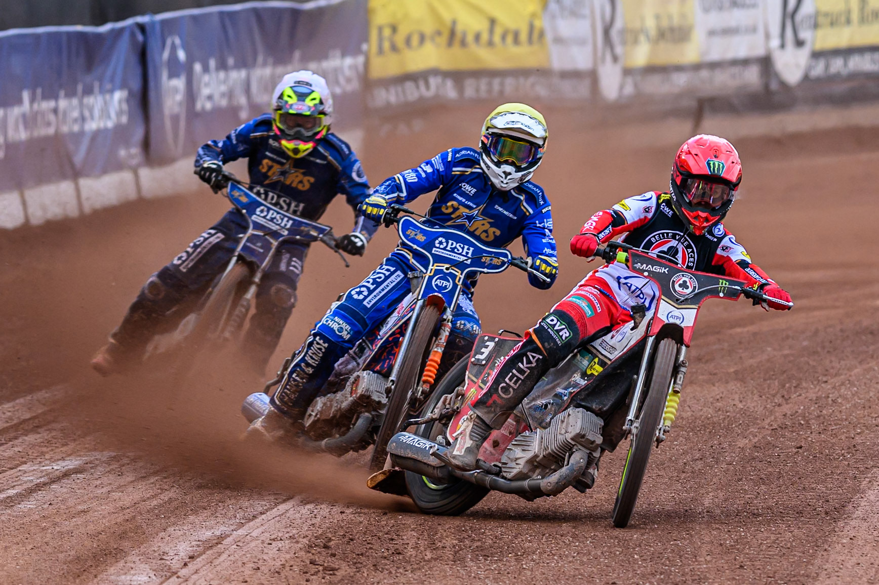 Belle Vue Aces' Jaimon Lidsey in Red leading Kings Lynn Stars' Niels-Kristian Iversen in Yellow and Kings Lynn Stars' Richard Lawson in White during the Rowe Motor Oil Premiership match between Belle Vue Aces and King's Lynn Stars at the National Speedway Stadium, Manchester on Monday 23rd June 2025. (Photo: Ian Charles | MI News)