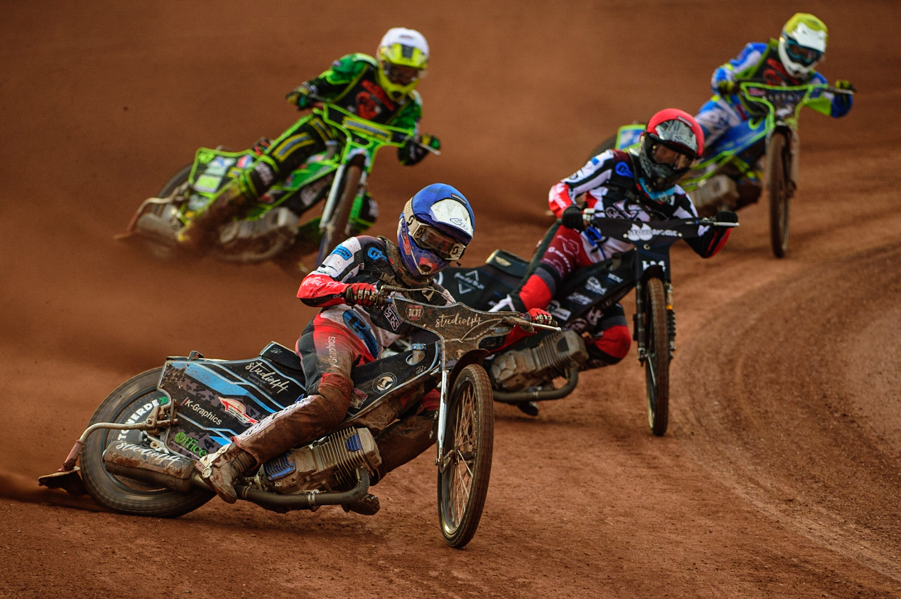 Freddy Hodder  (Blue) leads Harry McGurk  (Red) Sam Bebee  (White) and Luke Muff  (Yellow) during the National Development League match between Belle Vue Colts and Mildenhall Fens Tigers at the National Speedway Stadium, Manchester on Friday 15th July 2022. (Credit: Ian Charles | MI News)