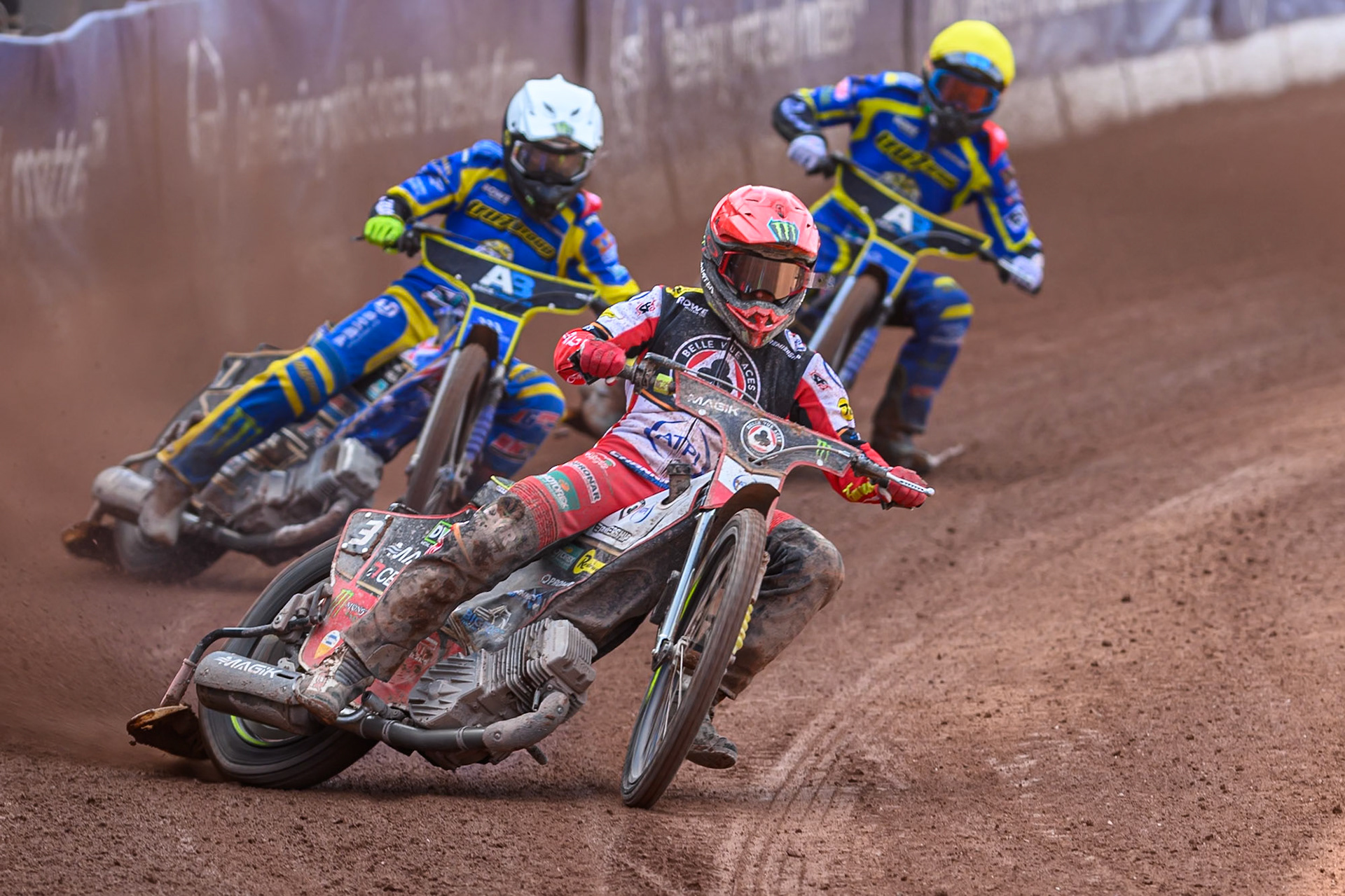 Jaimon Lidsey of Belle Vue Aces  in Red leading Jack Holder of Sheffield Tigers  in White and Anders Rowe of Sheffield Tigers  in Yellow during the Rowe Motor Oil Premiership match between Belle Vue Aces and Sheffield Tigers at the National Speedway Stadium, Manchester on Monday 25th August 2025. (Photo: Ian Charles | MI News)