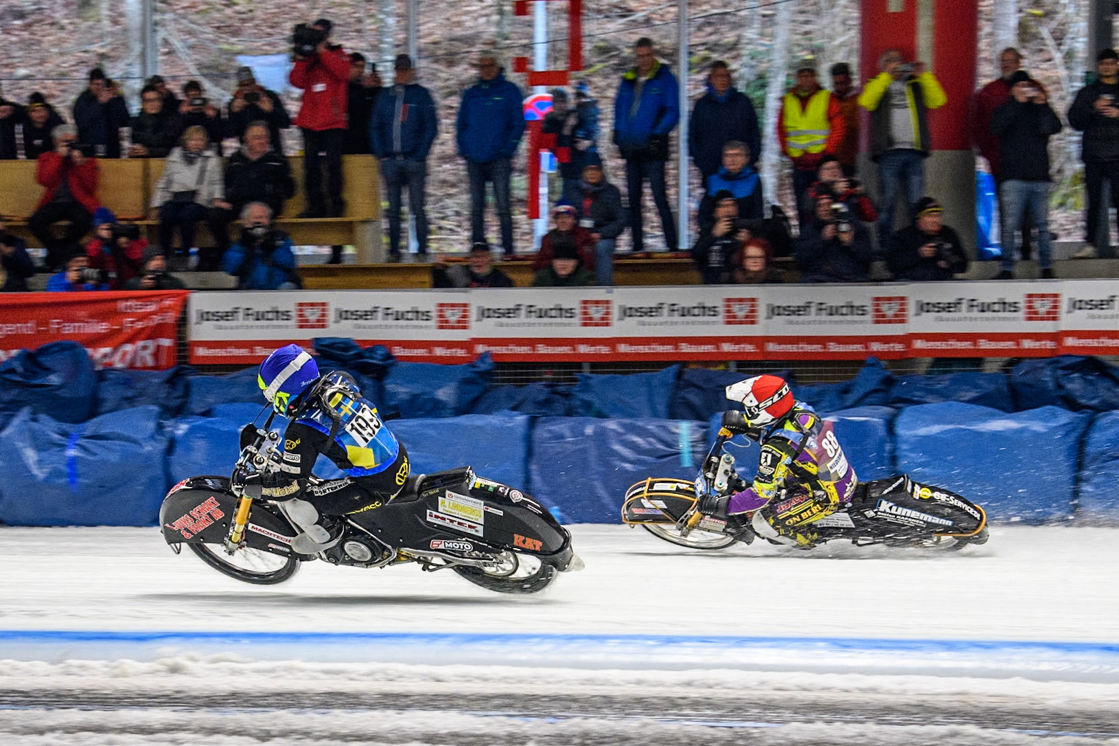 Sweden's Martin Haarahiltunen (199)  (Blue) passes Germany's Max Niedermaier (88) in the Final during the FIM Ice Speedway Gladiators World Championship Final 2 at the Max-Aicher-Arena, Inzell on Sunday 24 March 2024. (Photo: Ian Charles | MI News)