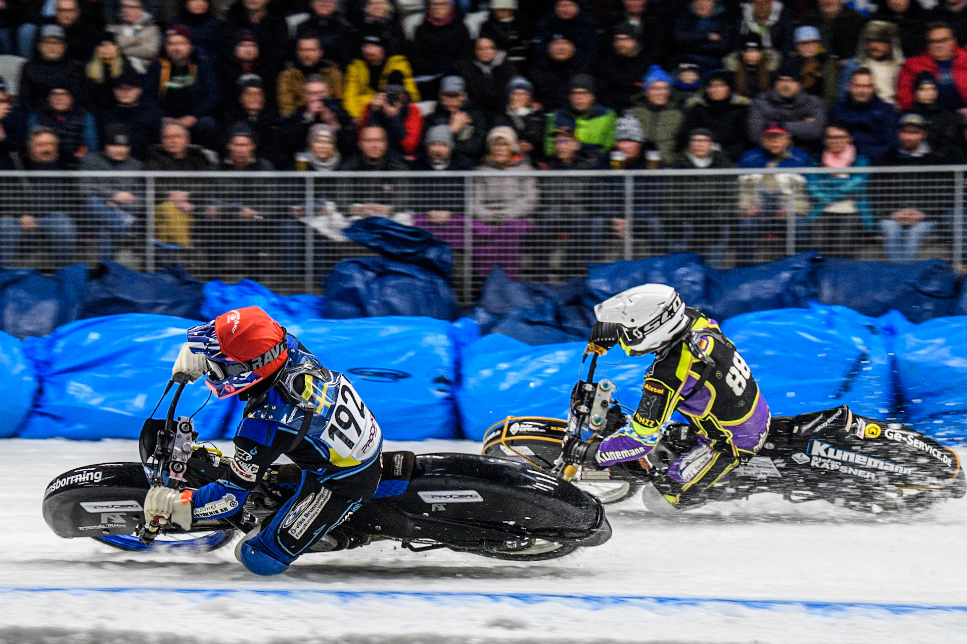 Niclas Svensson (192) of Sweden in Red rides inside Max Niedermaier  (88) of Germany in White during the Ice Speedway Gladiators World Championship Final 2 at Max-Aicher-Arena, Inzell on Sunday 16th March 2025. (Photo: Ian Charles | MI News)