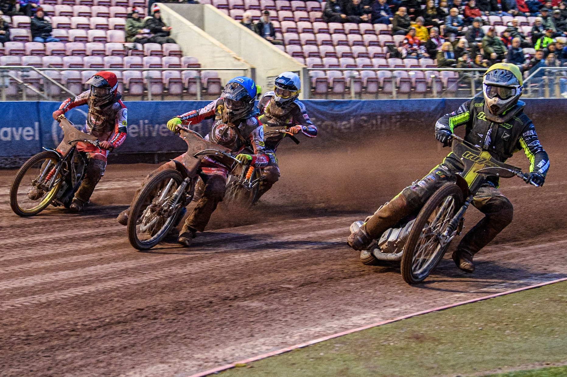 Ipswich Witches' Dan Thompson in Yellow leading Belle Vue Aces' Connor Bailey in Blue, Belle Vue Aces' Norick Blödorn in Red and Ipswich Witches' Jordan Jenkins  in White during the Rowe Motor Oil Premiership match between Belle Vue Aces and Ipswich Witches at the National Speedway Stadium, Manchester on Monday 22nd April 2024. (Photo: Ian Charles | MI News)