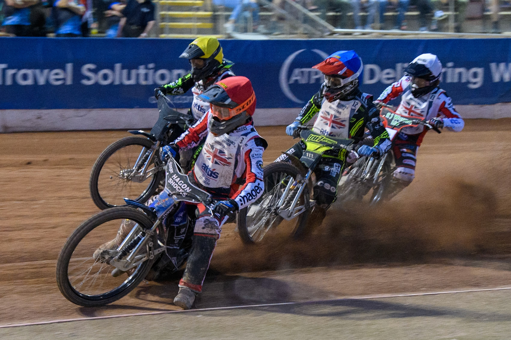 Jason Edwards in Red rides inside Adam Ellis in Blue, Danny King in White and Craig Cook in Yellow during the Attis Insurance Sports Division British Final at the National Speedway Stadium, Manchester on Monday 12th May 2025. (Photo: Ian Charles | MI News)
