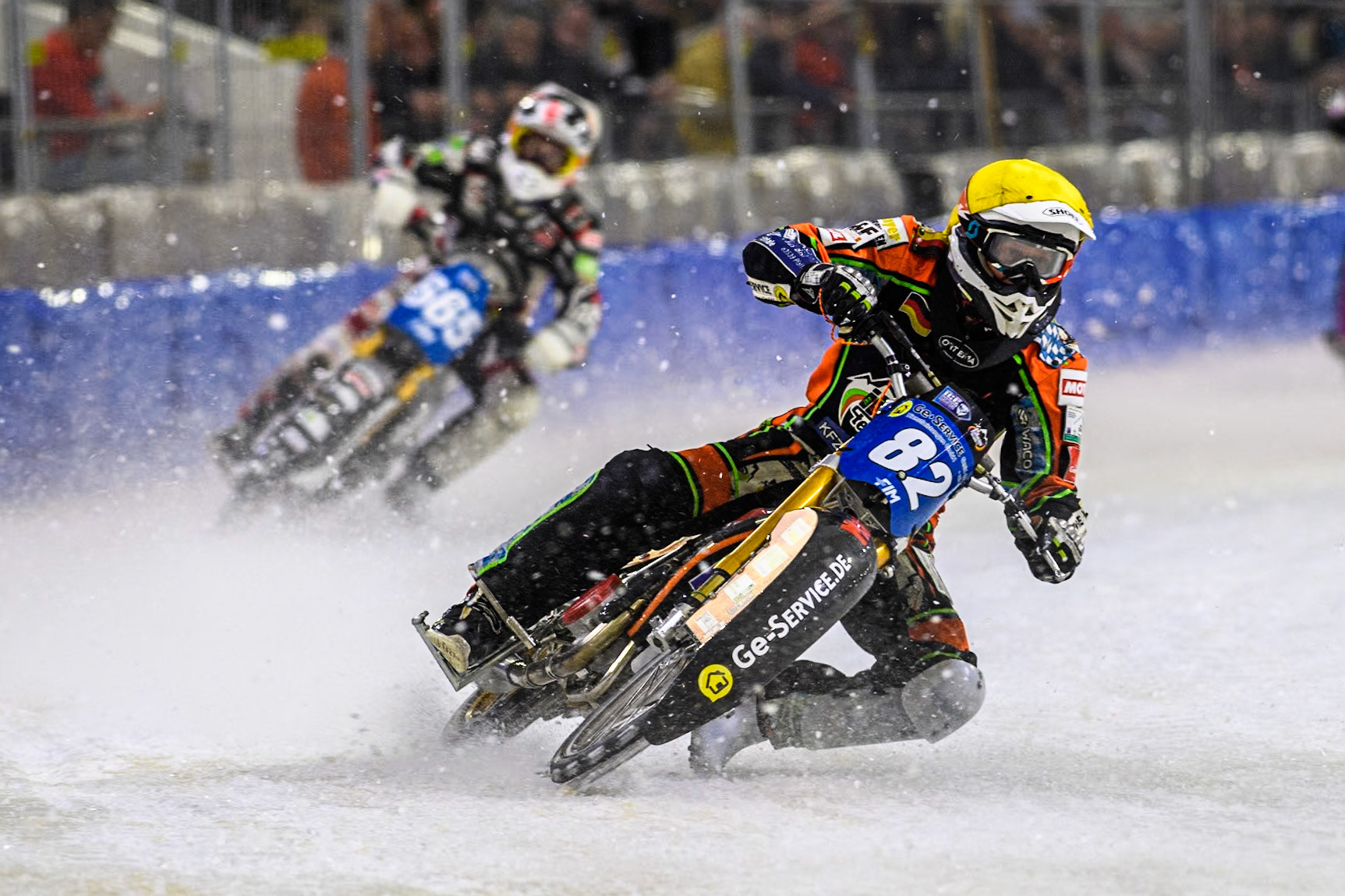 Germany's Markus Jell (82) in Yellow leading Austria's Charly Ebner (665) in White during the FIM Ice Speedway Gladiators World Championship Final 3 at Ice Rink Thialf, Heerenveen on Saturday 6th April 2024. (Photo: Ian Charles | MI News)