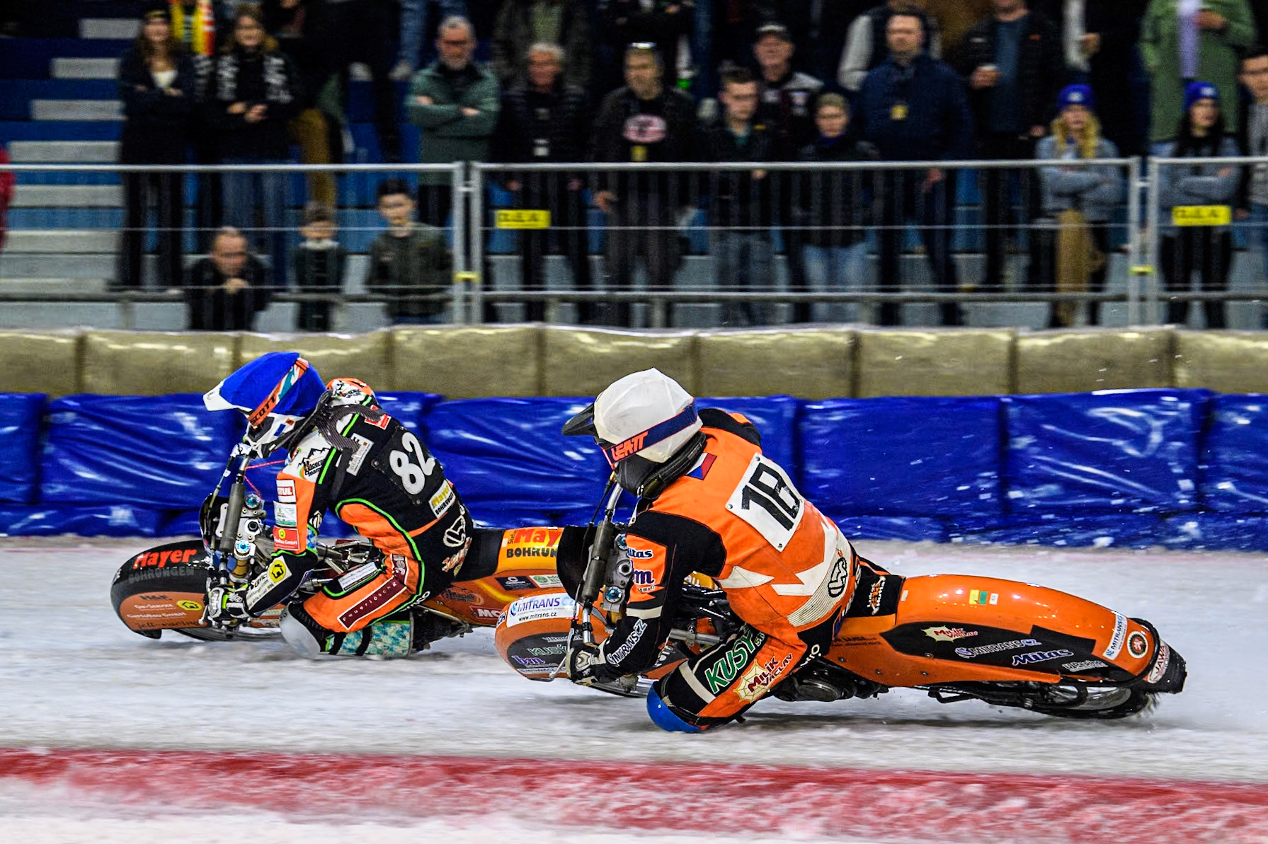 Reserve Czech Republic's Lukáš Hutla (18) in White chases Germany's Markus Jell (82) in Blue during the FIM Ice Speedway Gladiators World Championship Final 3 at Ice Rink Thialf, Heerenveen on Saturday 6th April 2024. (Photo: Ian Charles | MI News)