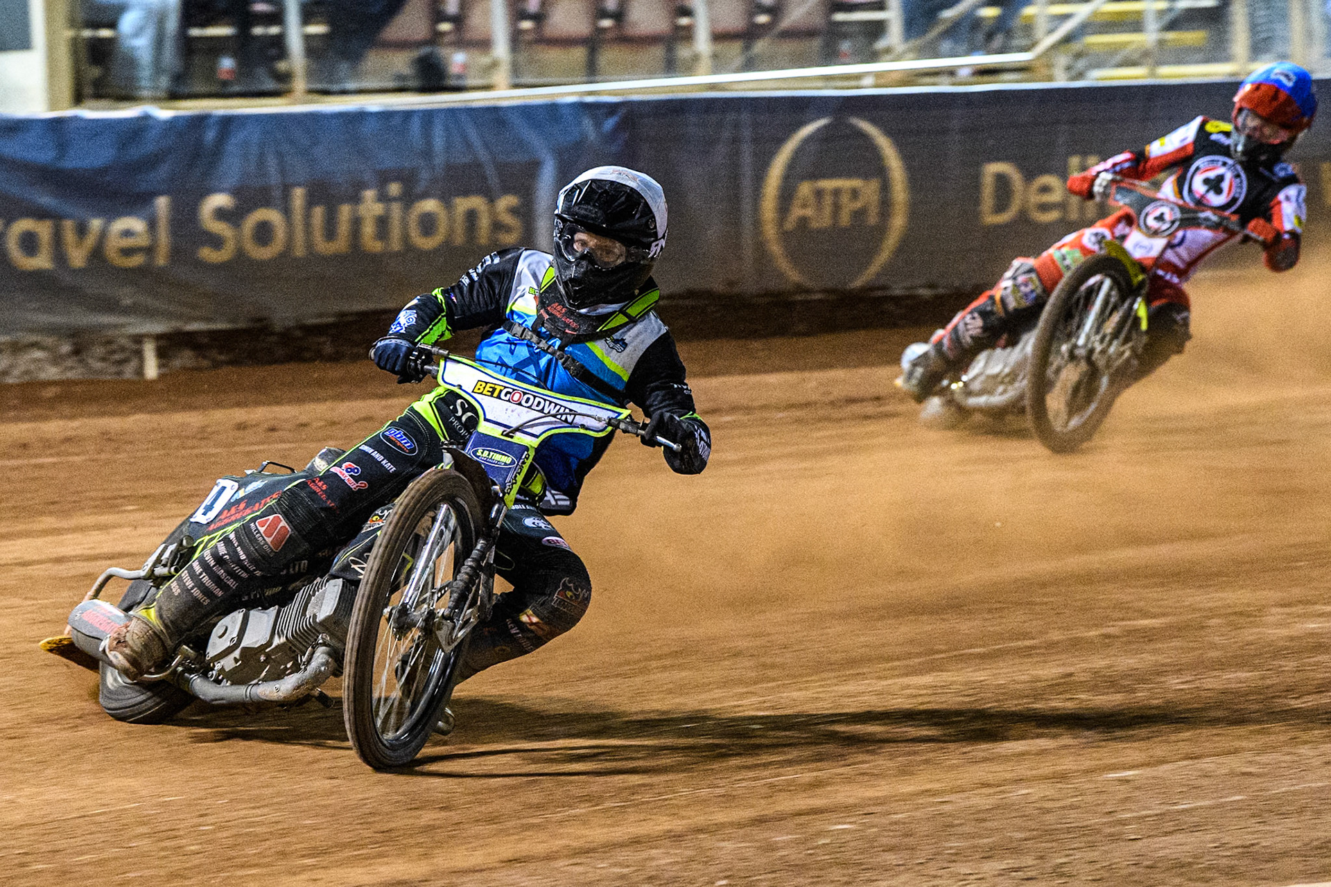 Oxford Spires' Guest Rider Dan Thompson in White leading Belle Vue Aces' Tate Zischke in Blue during the Rowe Motor Oil Premiership match between Belle Vue Aces and Oxford Spires at the National Speedway Stadium, Manchester on Monday 14th April 2025. (Photo: Ian Charles | MI News)