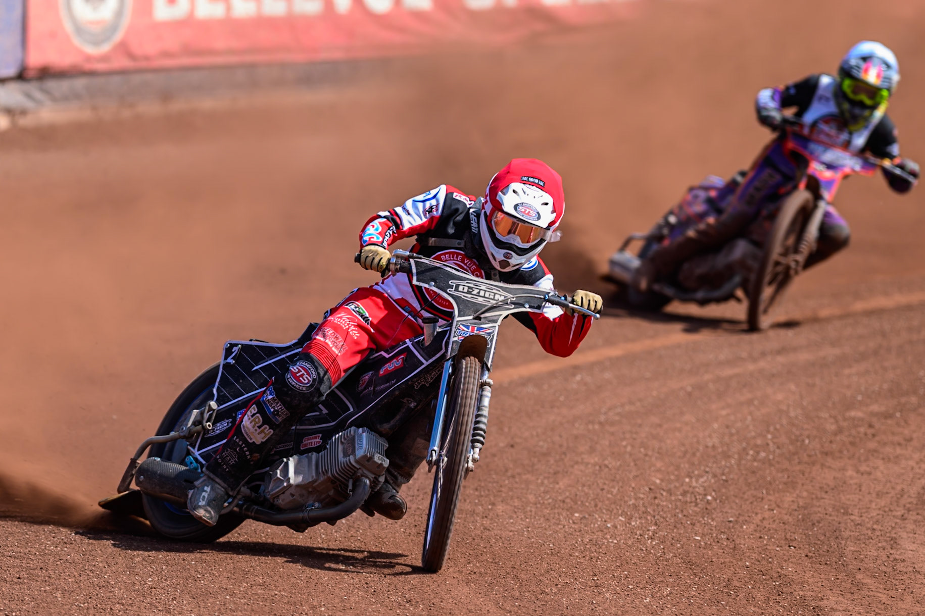 Jack Shimelt of Belle Vue Colts   in Red leading Elliot Kelly of Middlesborough Tigers  in White during the WSRA National Development League match between Belle Vue Colts and Middlesbrough Tigers at the National Speedway Stadium, Manchester on Sunday 10th August 2025. (Photo: Mark Fletcher | MI News)