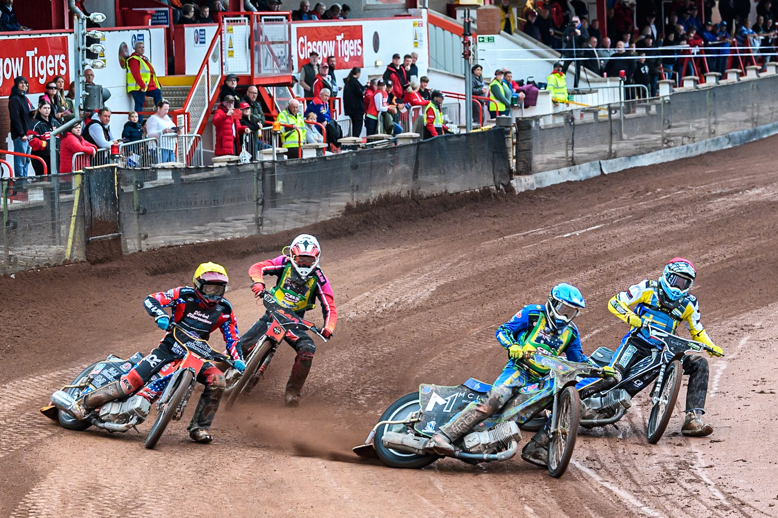 Michael West of Australia in Blue leading Noel Wahlquist of Sweden in Red, Alex Adamson of Australia in White and Timmy Dion of the United States in Yellow during the FIM SGP2 Qualifying Round at the Peugeot Ashfield Stadium in Glasgow on Saturday 24th May 2025. (Photo: Ian Charles | MI News)
