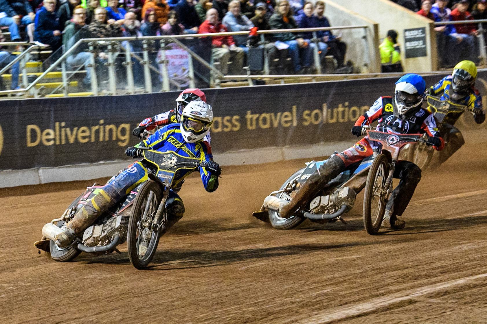 Sheffield Tigers' Josh Pickering  in White leading Belle Vue Aces' Ben Cook  in Red, Belle Vue Aces' Antti Vuolas  in Blue and Sheffield Tigers' Dan Gilkes  in Yellow during the Rowe Motor Oil Premiership Play Off Semi Final 2, 1st Leg match between Belle Vue Aces and Sheffield Tigers at the National Speedway Stadium, Manchester on Monday 16th September 2024. (Photo: Ian Charles | MI News)