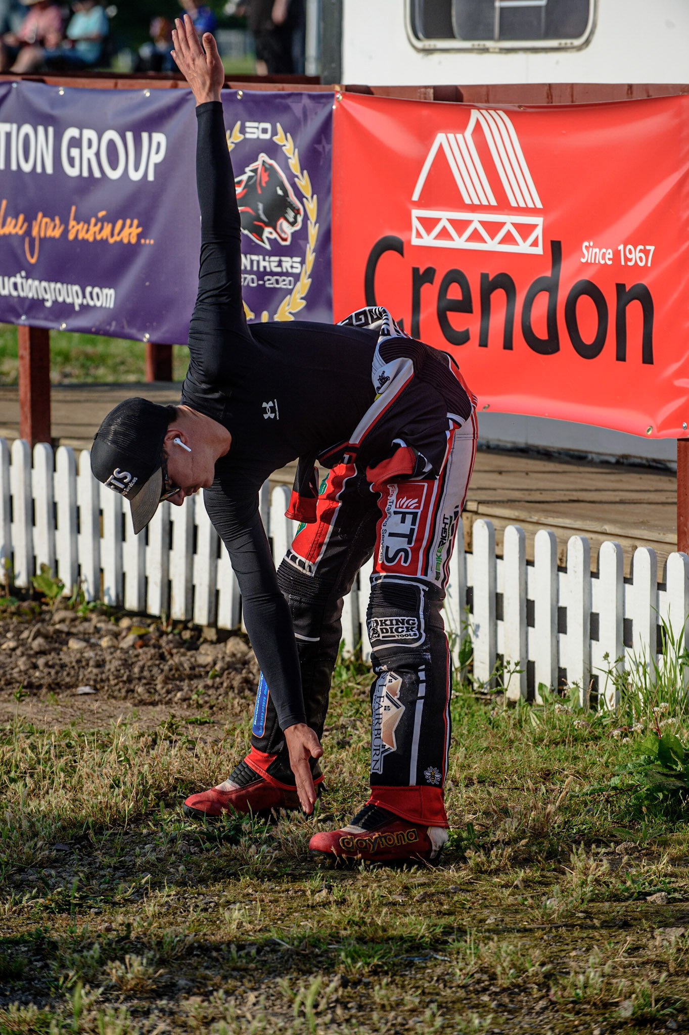 PETERBOROUGH, UK. JULY 19TH Belle Vue BikeRight Aces  rider Jye Etheridge  does some stretching exercises to get rear for his first race  during the SGB Premiership match between Peterborough and Belle Vue Aces at East of England Showground, Peterborough on Monday 19th July 2021. (Credit: Ian Charles | MI News)