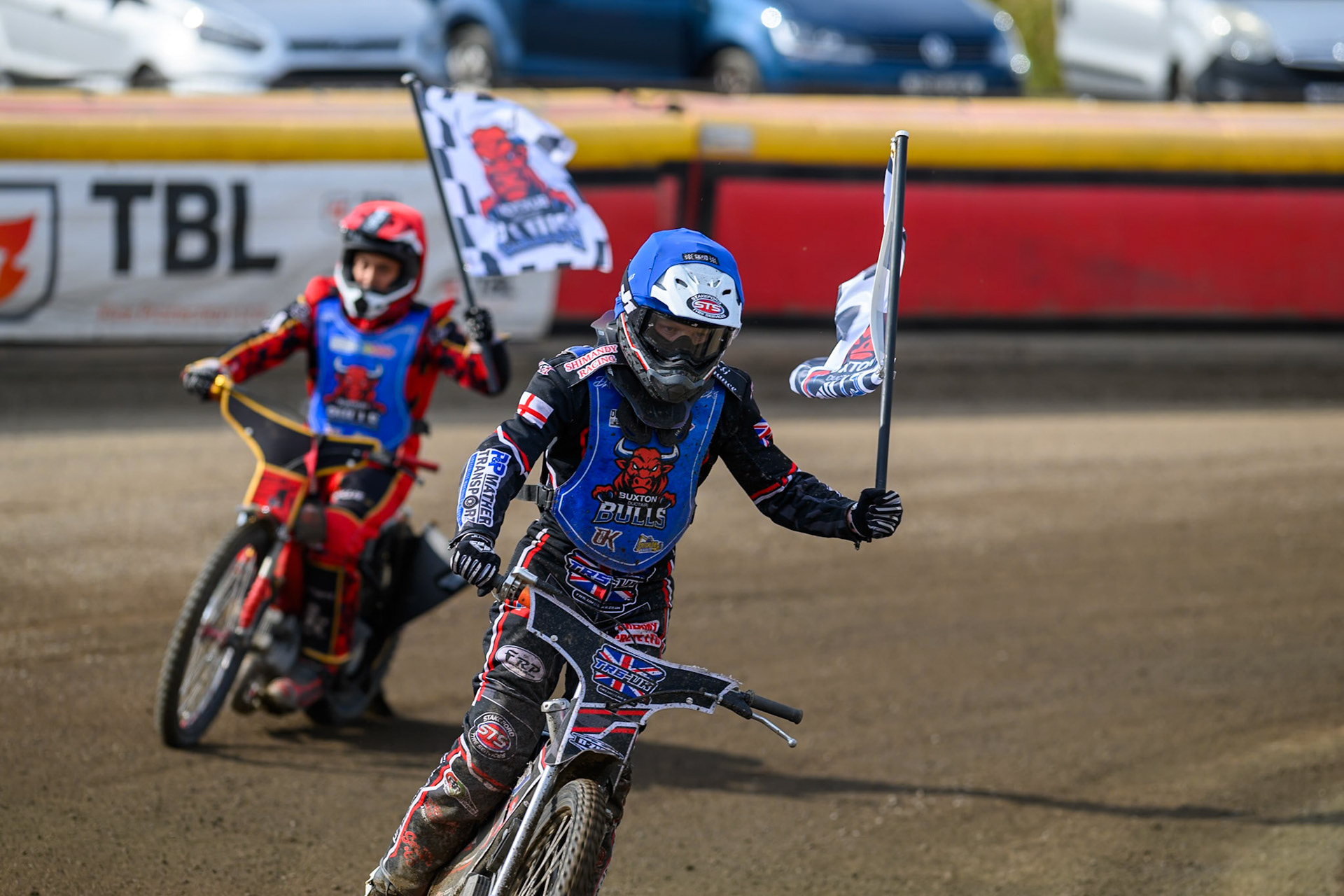Jack Shimelt of Buxton Bulls in Blue  and Luke Harris of Buxton Bulls in Red  celebrate their heat win with the Bulls Flags during the WSRA National Development League match  between Buxton Bulls and Middlesborough Tigers at Hi-Edge Speedway, Buxton on Sunday 16th August 2026. (Photo: Ian Charles | MI News)