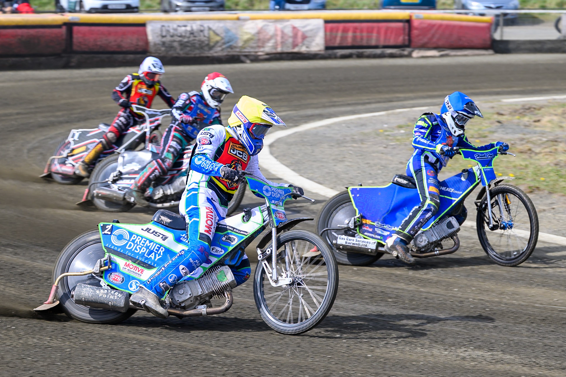 Tom Spencer of Leicester Lion Cubs  in Yellow rides outside Arran Butcher of Buxton Bulls  with Alfie Bowtell of Buxton Bulls  and Ben Morley of Leicester Lion Cubs in White behind during the Challenge match between Buxton Bulls and Leicester Lion Cubs at Hi-Edge Speedway, Buxton on Sunday 26th April 2026. (Photo: Ian Charles | MI News)
