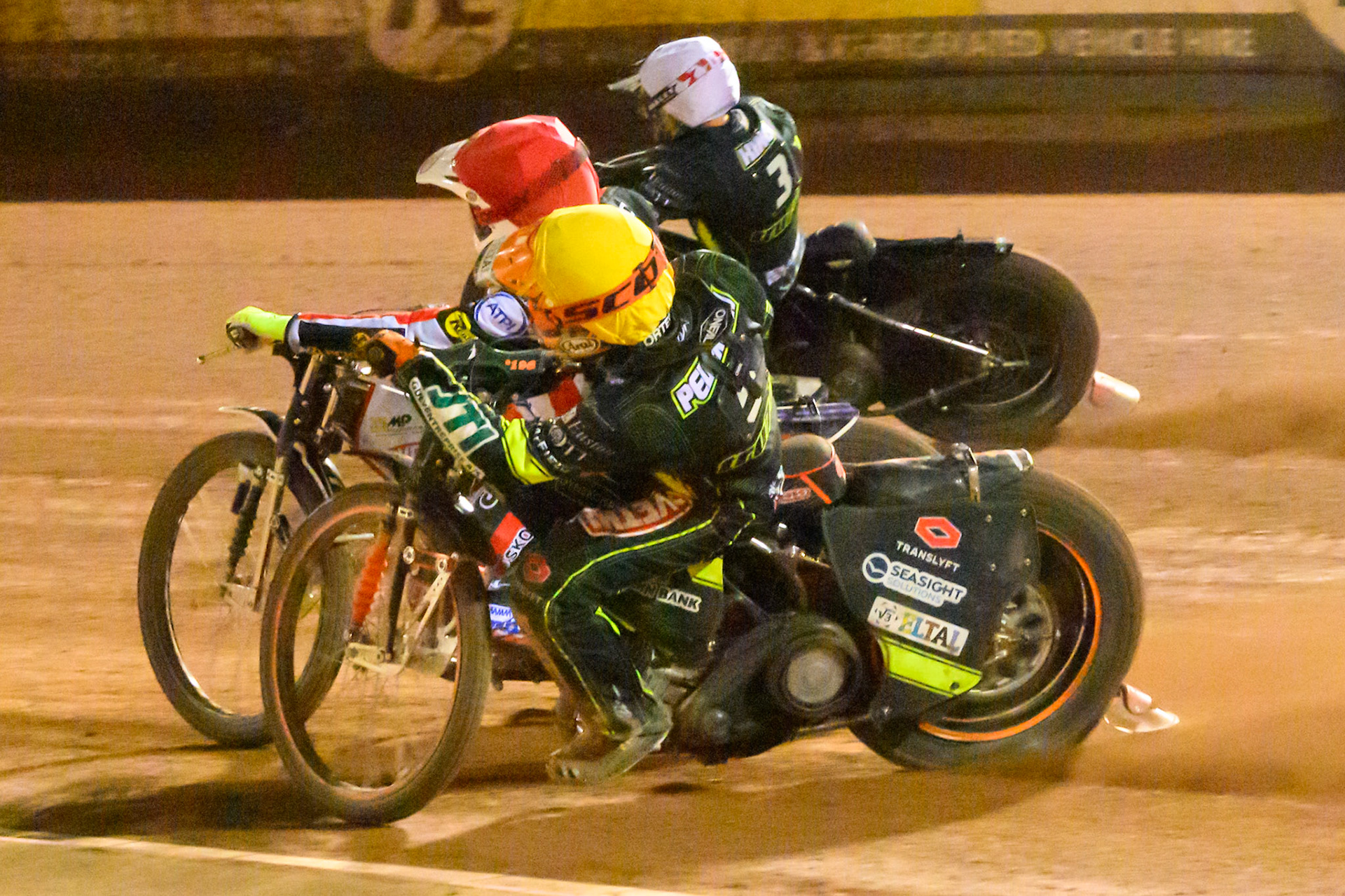 Kevin Juul Pedersen of Ipswich Witches in Yellow rides inside Peter Kildemand of Belle Vue Aces in Red  and Danny King of Ipswich Witches in White during the Rowe Motor Oil Premiership Play Off Semi Final 2nd leg match between Belle Vue Aces and Ipswich Witches at the National Speedway Stadium, Manchester on Monday 28th September 2026. (Photo: Ian Charles | MI News)