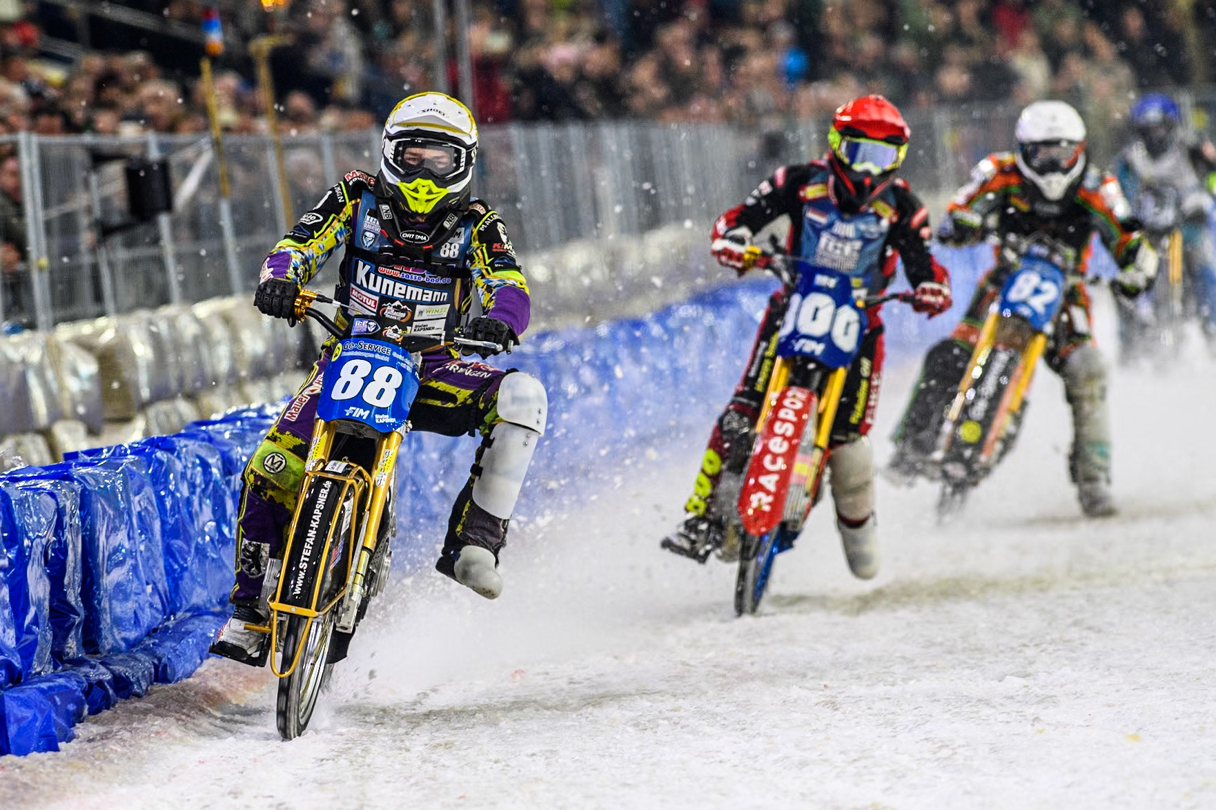 Germany's Max Niedermaier (88) in Yellow leading Netherlands' Jasper Iwema (800) in Red and Germany's Markus Jell (82) in White during the FIM Ice Speedway Gladiators World Championship Final 4 at Ice Rink Thialf, Heerenveen on Sunday 7th April 2024. (Photo: Ian Charles | MI News)