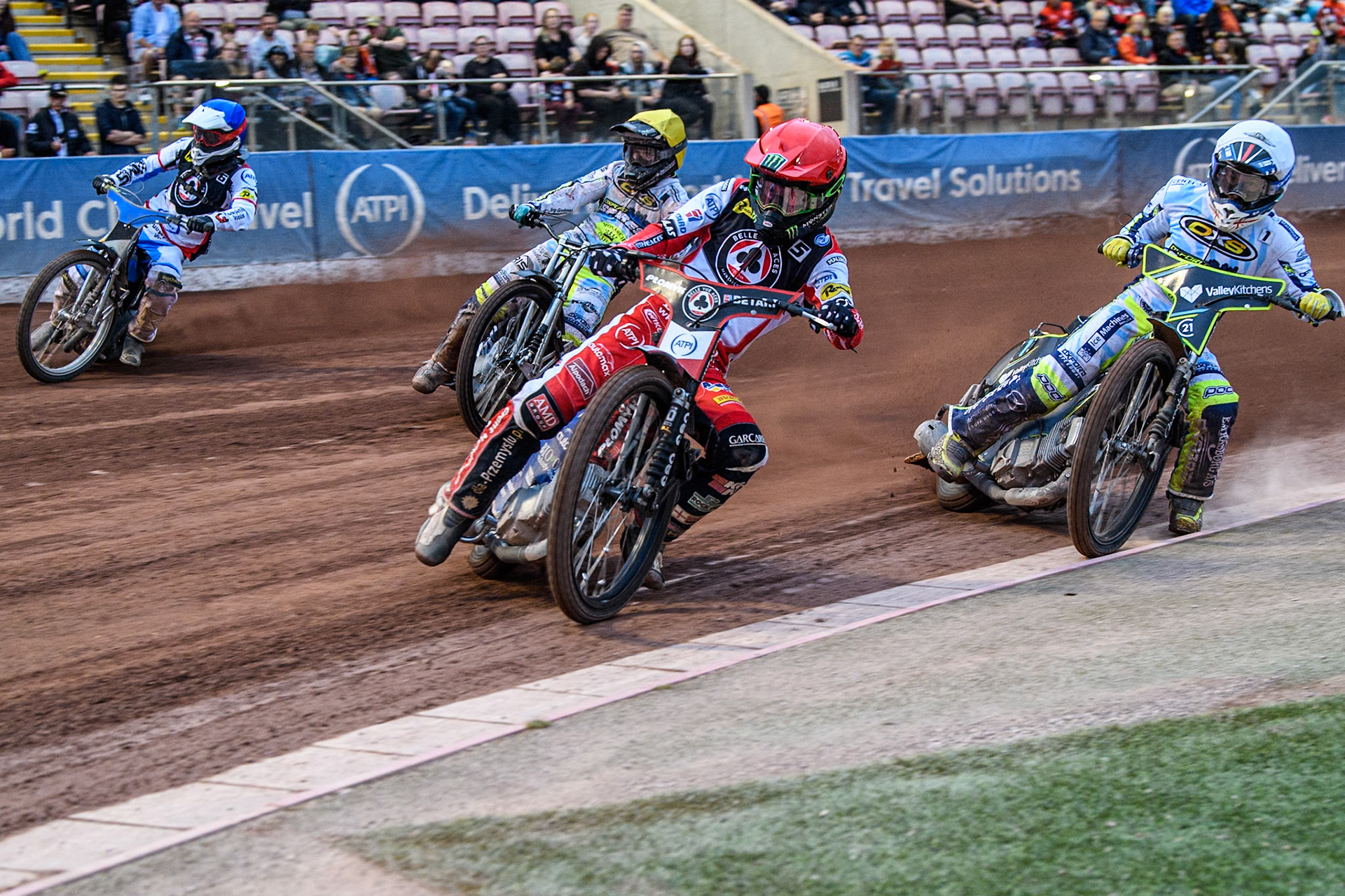 Belle Vue Aces' Dan Bewley  in Red leading Oxford Spires' Rohan Tungate  in White, Oxford Spires' Erik Riss  in Yellow and Belle Vue Aces' guest Antti Vuolas  in Blue during the Rowe Motor Oil Premiership match between Belle Vue Aces and Oxford Spires at the National Speedway Stadium, Manchester on Monday 22nd July 2024. (Photo: Ian Charles | MI News)