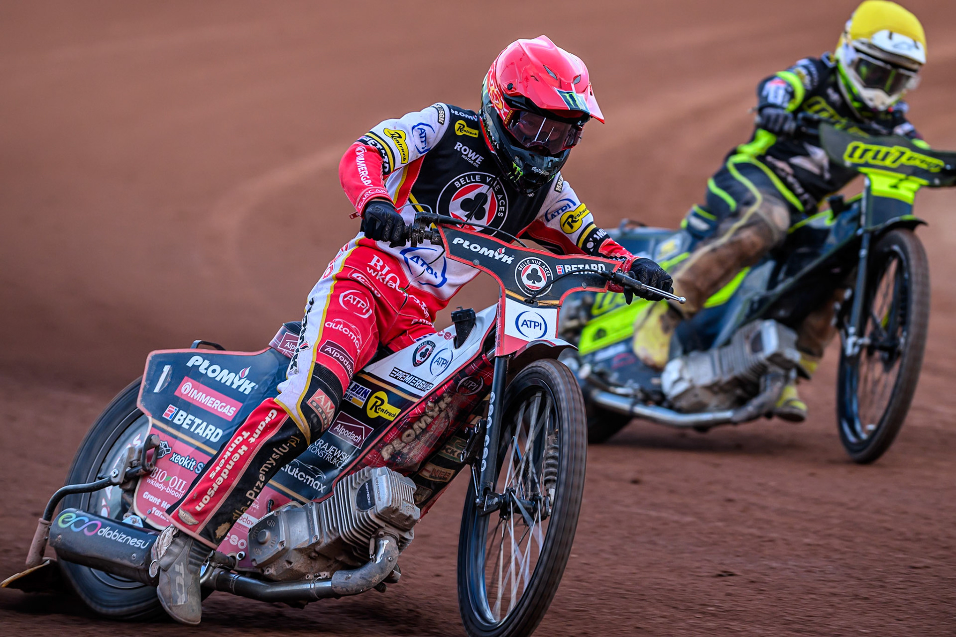 Belle Vue Aces' Dan Bewley  in Red leading Ipswich Witches' Tom Brennan  in Yellow during the Rowe Motor Oil Premiership match between Belle Vue Aces and Ipswich Witches at the National Speedway Stadium, Manchester on Monday 30th June 2025. (Photo: Ian Charles | MI News)